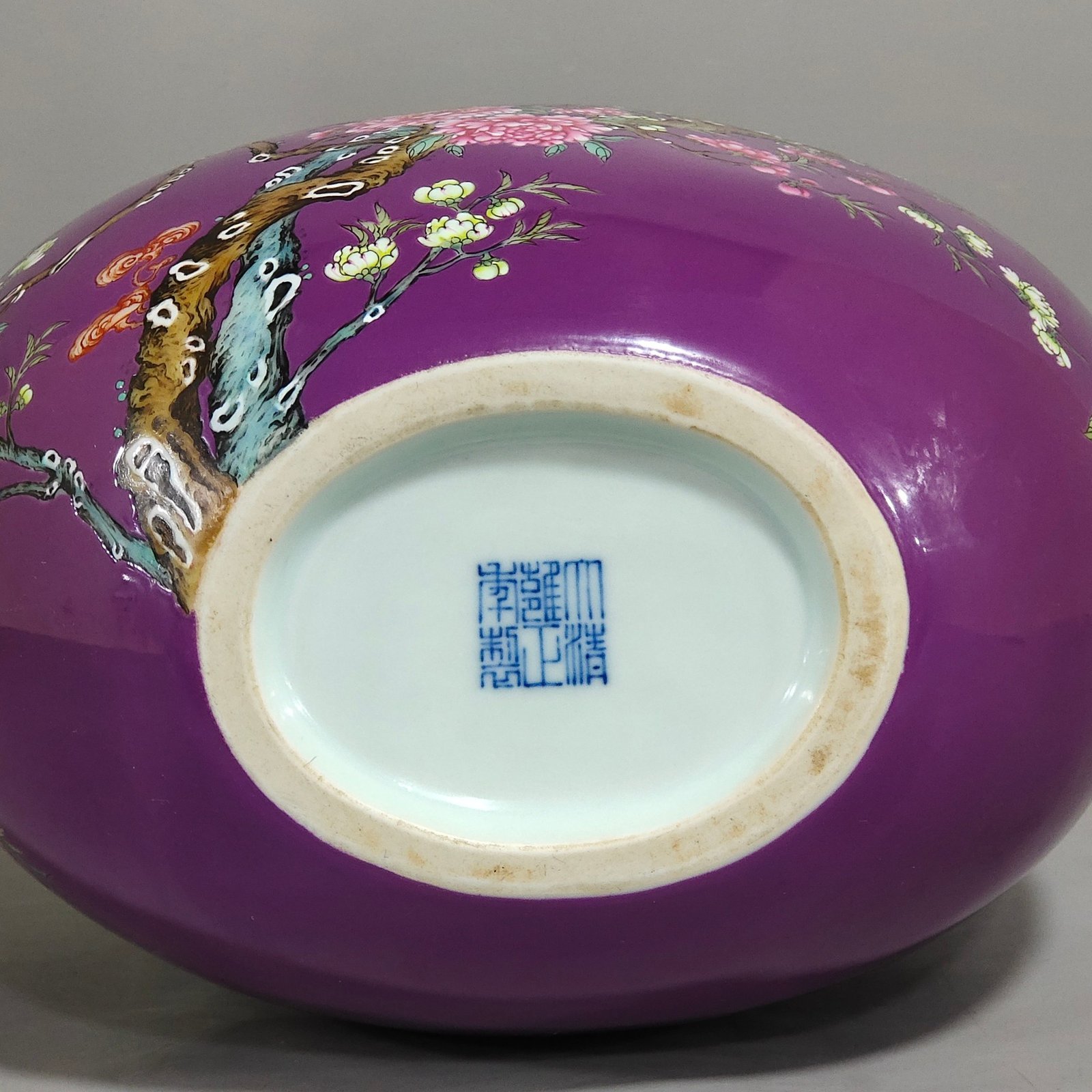 Qing Dynasty Yongzheng purple-glazed eggplant skin flower and bird holding the moon vase