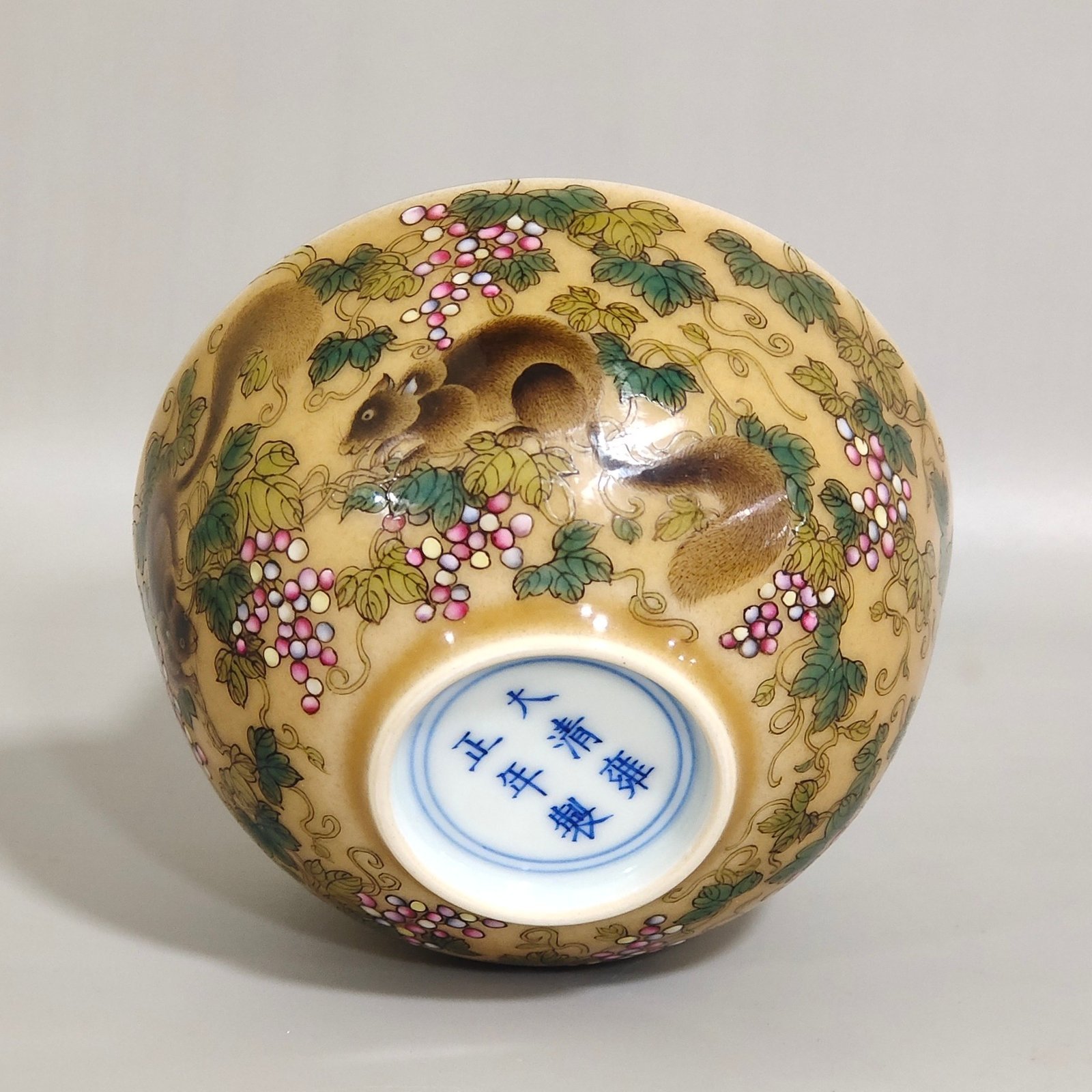 Qing Dynasty Yongzheng yellow-glazed squirrel grape cup