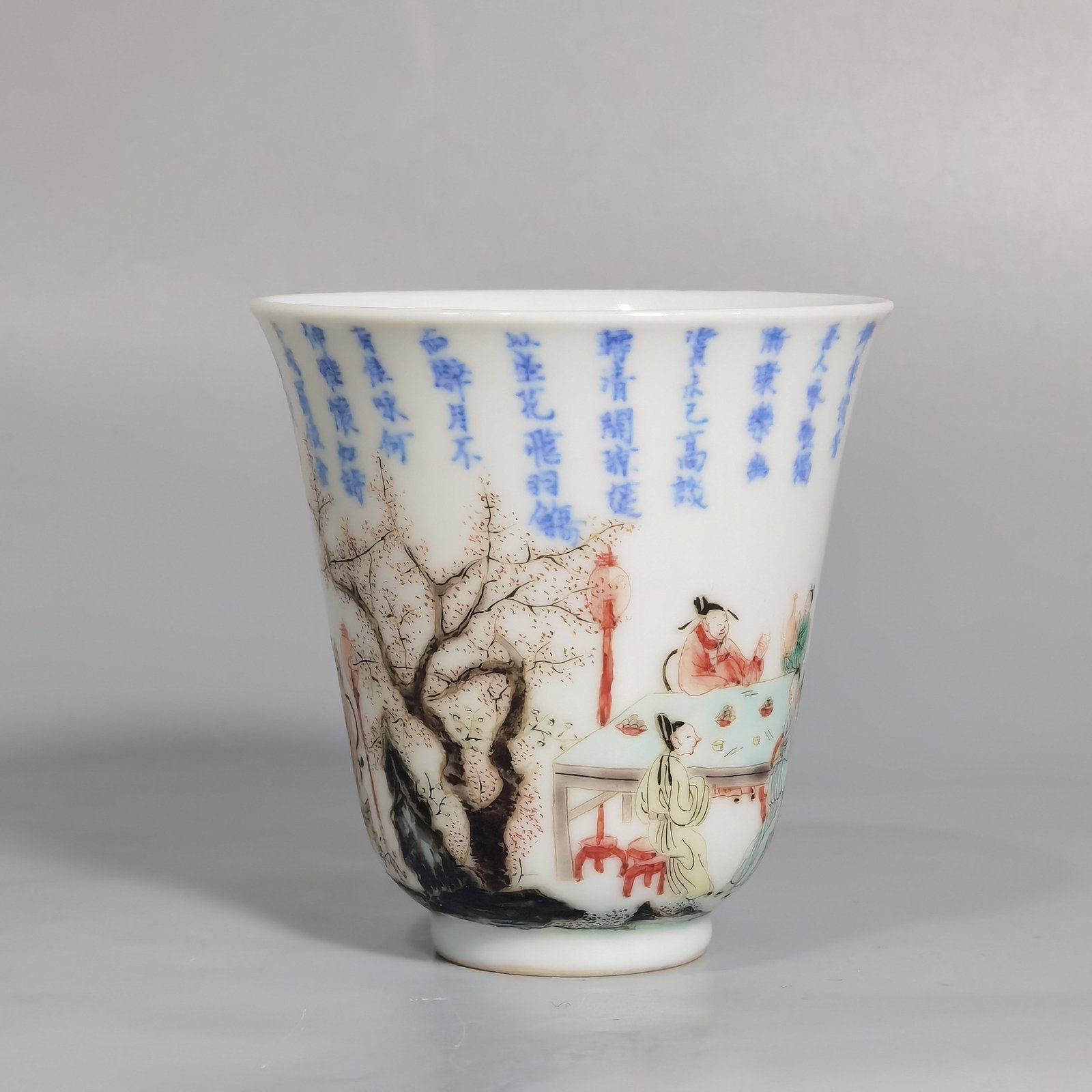 Qing Dynasty Kangxi blue and white colorful spring night banquet peach and plum garden poetry bell cup