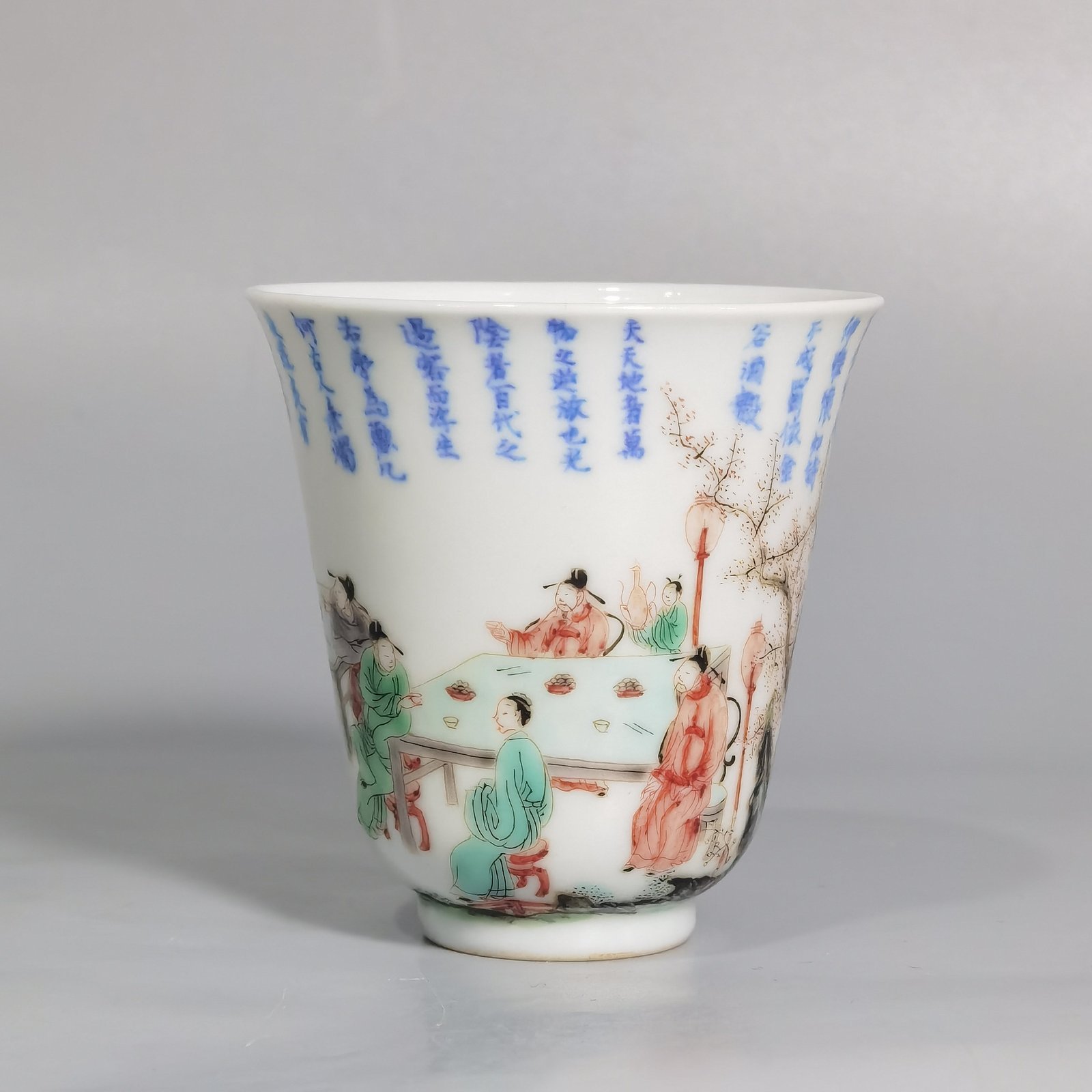 Qing Dynasty Kangxi blue and white colorful spring night banquet peach and plum garden poetry bell cup
