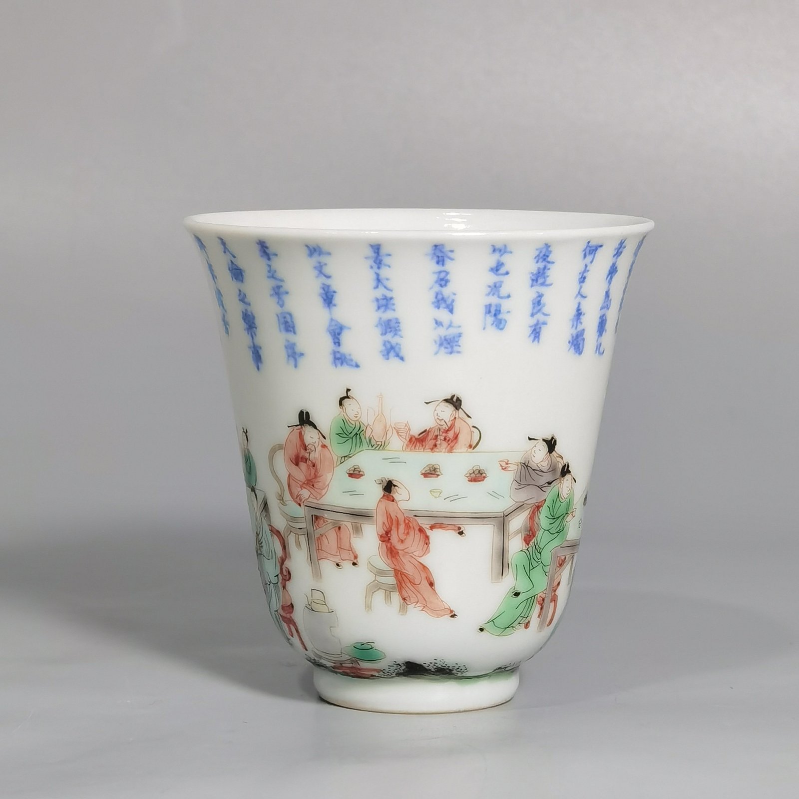 Qing Dynasty Kangxi blue and white colorful spring night banquet peach and plum garden poetry bell cup