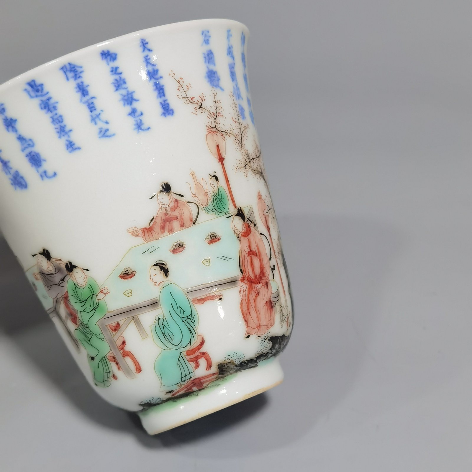 Qing Dynasty Kangxi blue and white colorful spring night banquet peach and plum garden poetry bell cup