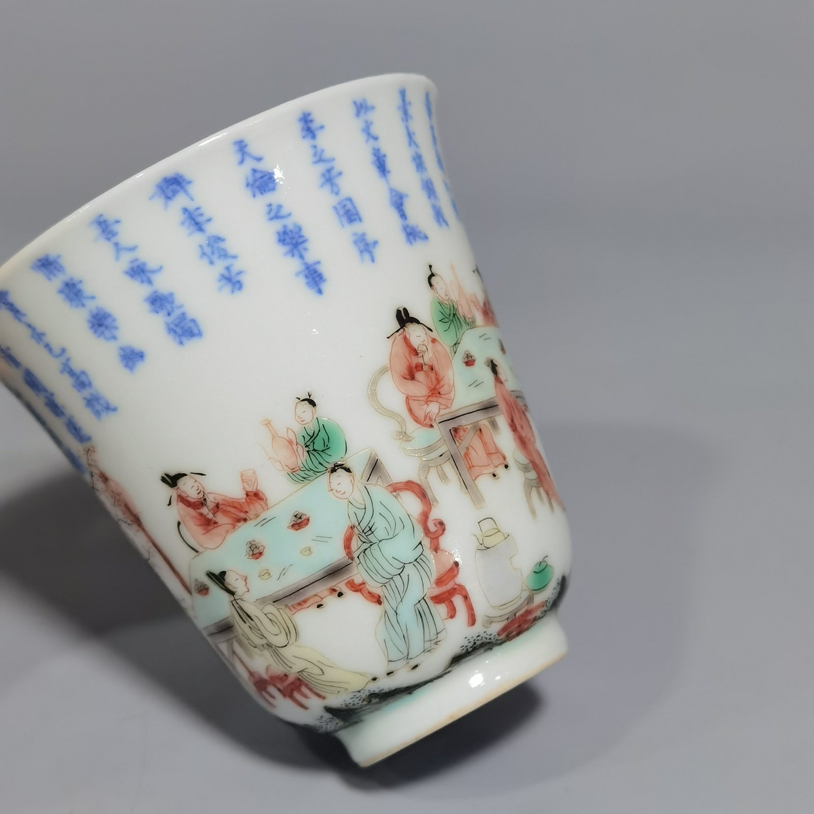 Qing Dynasty Kangxi blue and white colorful spring night banquet peach and plum garden poetry bell cup