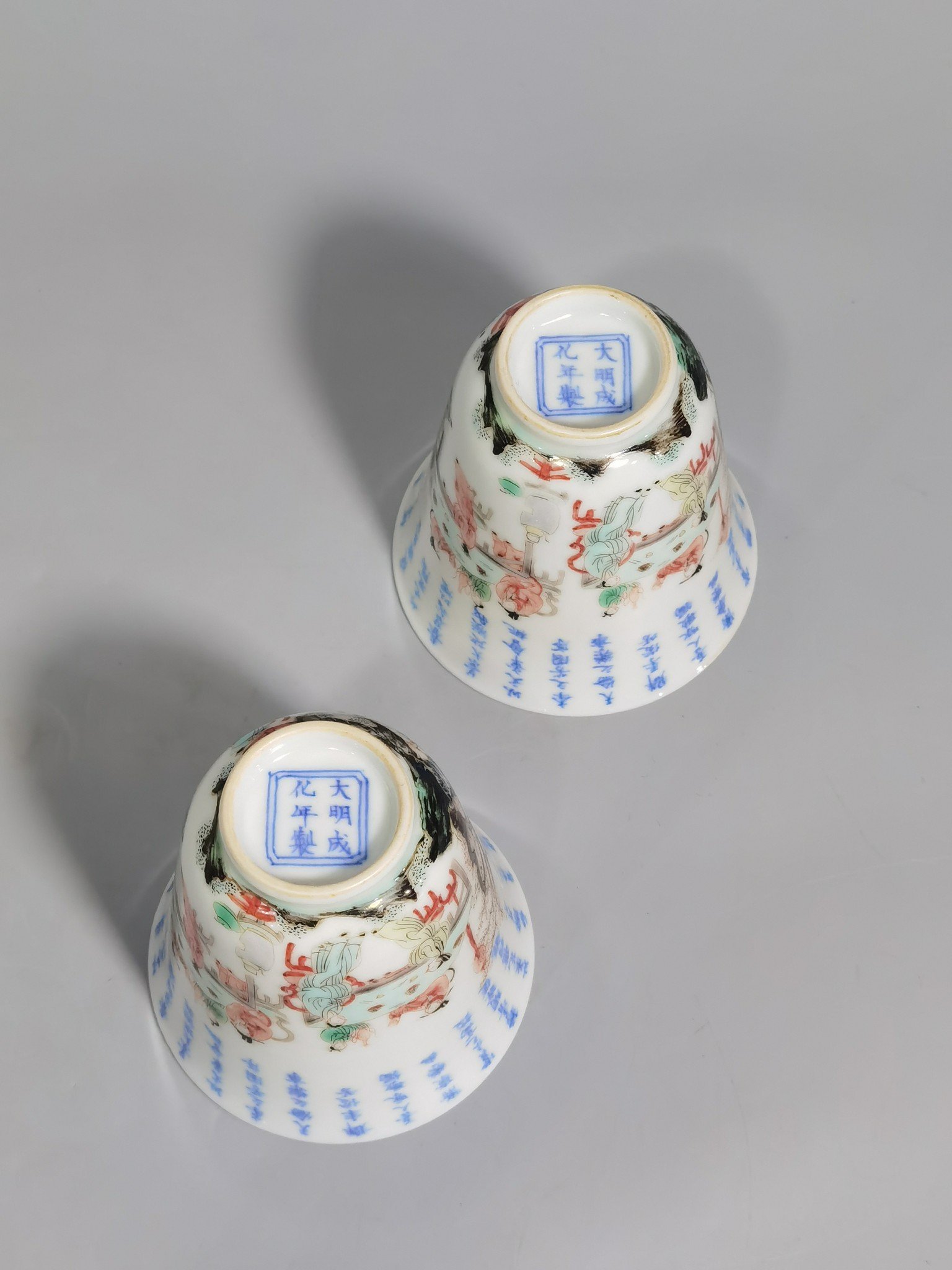 Qing Dynasty Kangxi blue and white colorful spring night banquet peach and plum garden poetry bell cup