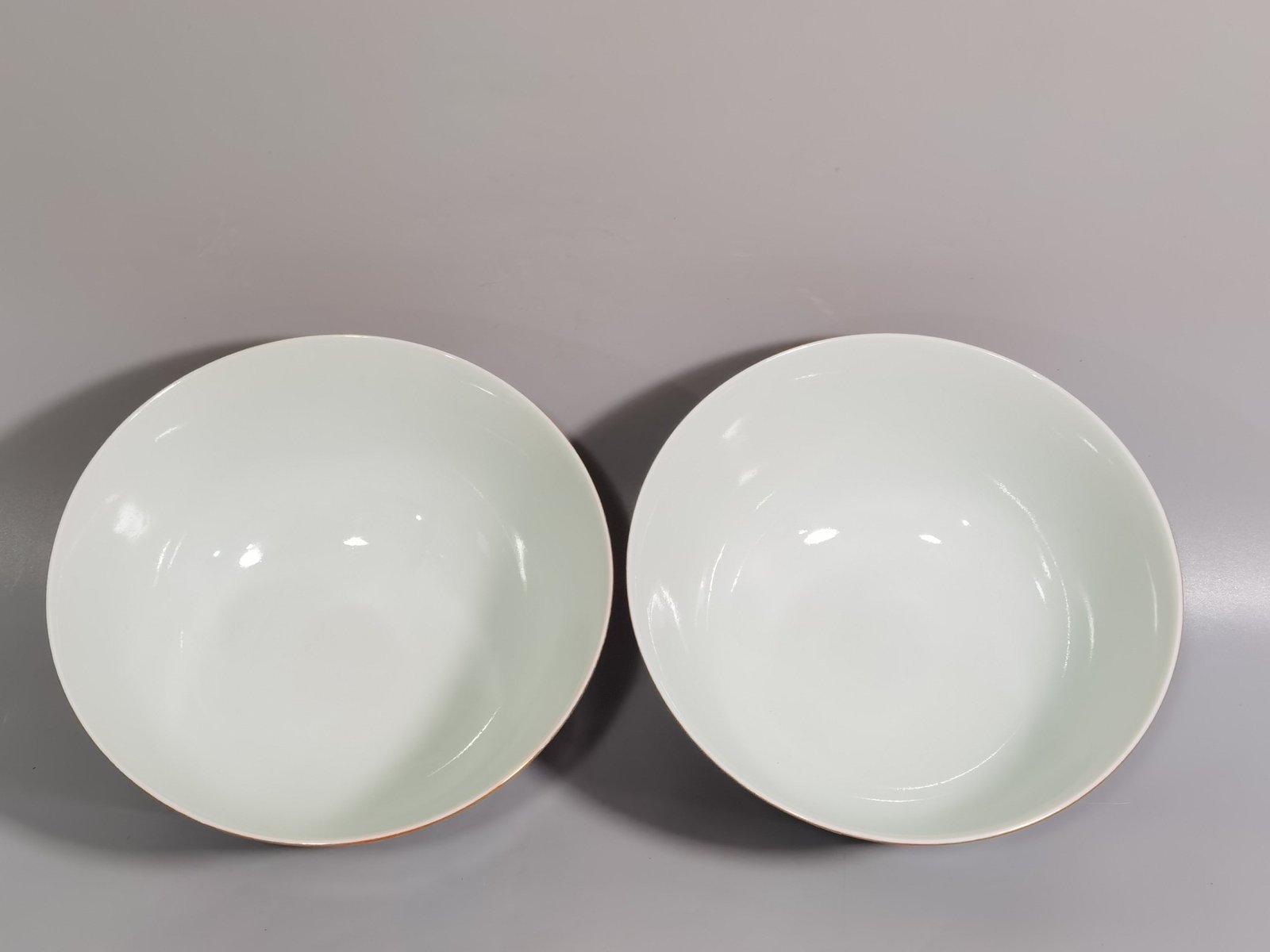 Qing Dynasty Yongzheng A pair of enamel-colored coral red ground nine-autumn bowls