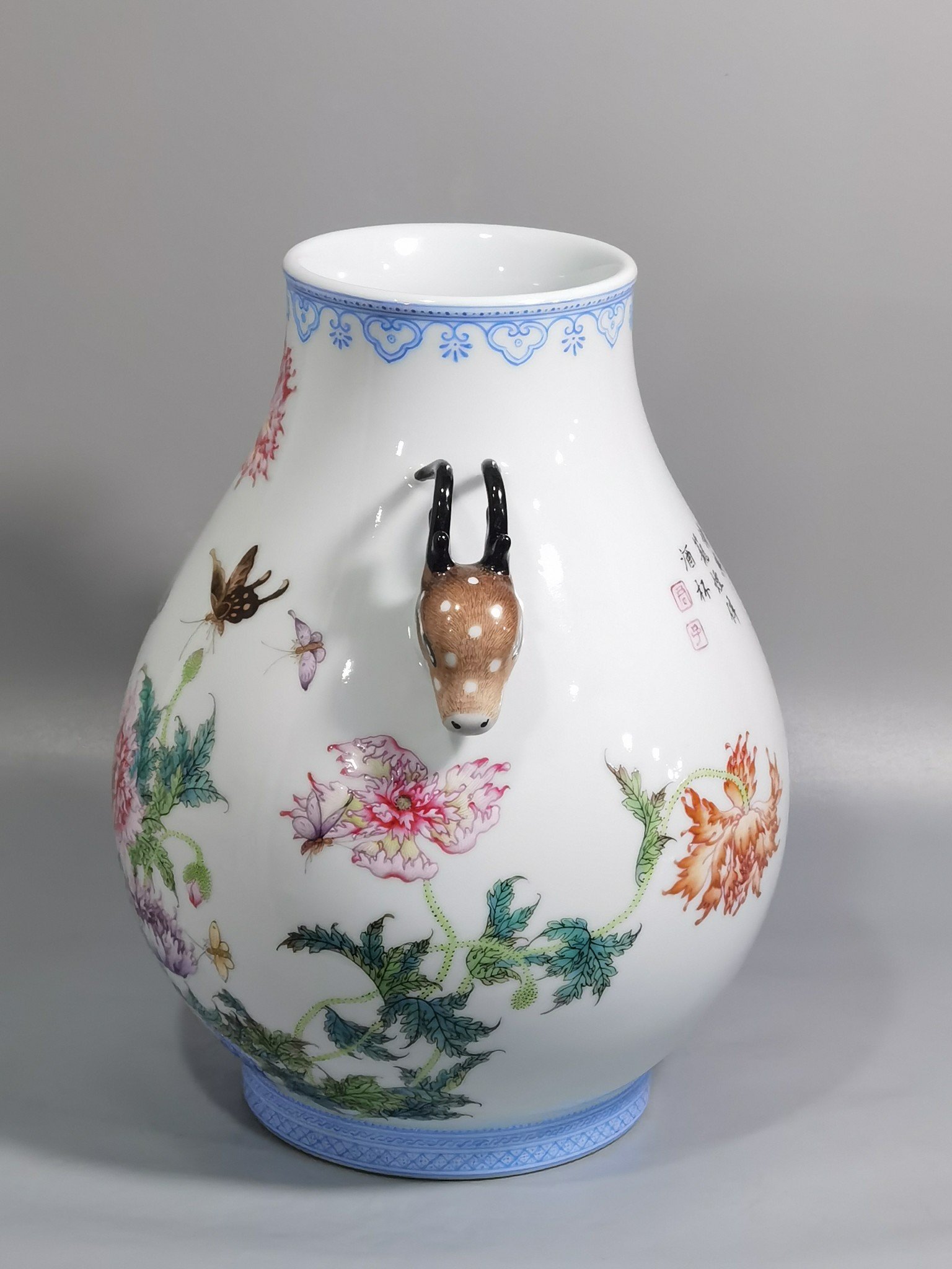Qing Dynasty Yongzheng a pastel poppy-inscribed deer-headed statue