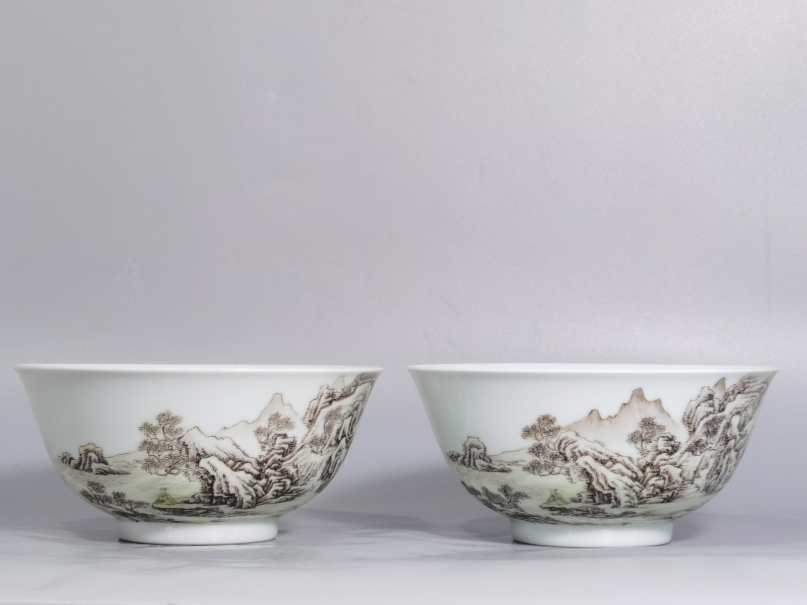 Qing Dynasty Yongzheng A pair of enamel and ink landscape and figure bowls