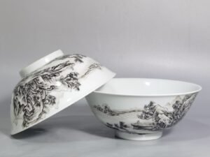 Qing Dynasty Yongzheng A pair of enamel and ink landscape and figure bowls
