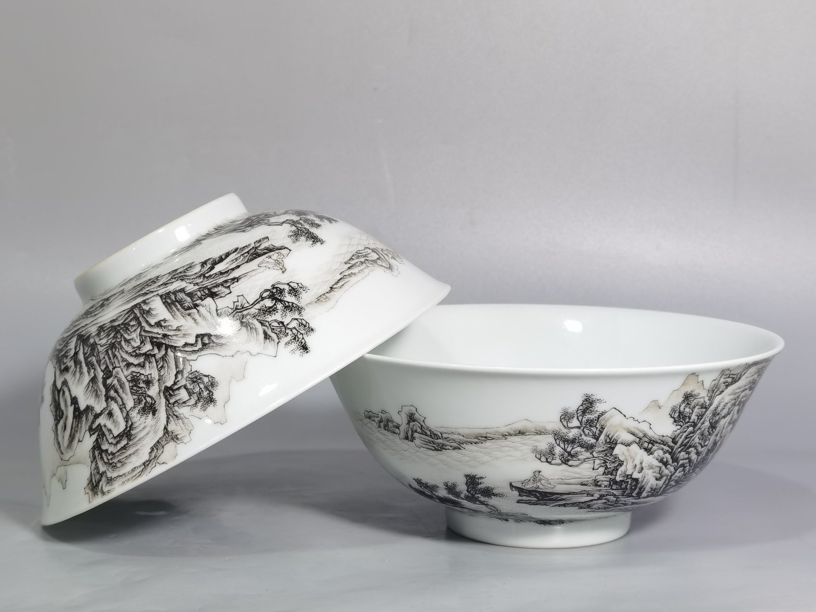 Qing Dynasty Yongzheng A pair of enamel and ink landscape and figure bowls