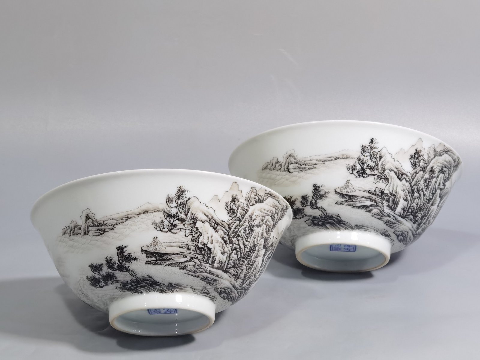 Qing Dynasty Yongzheng A pair of enamel and ink landscape and figure bowls