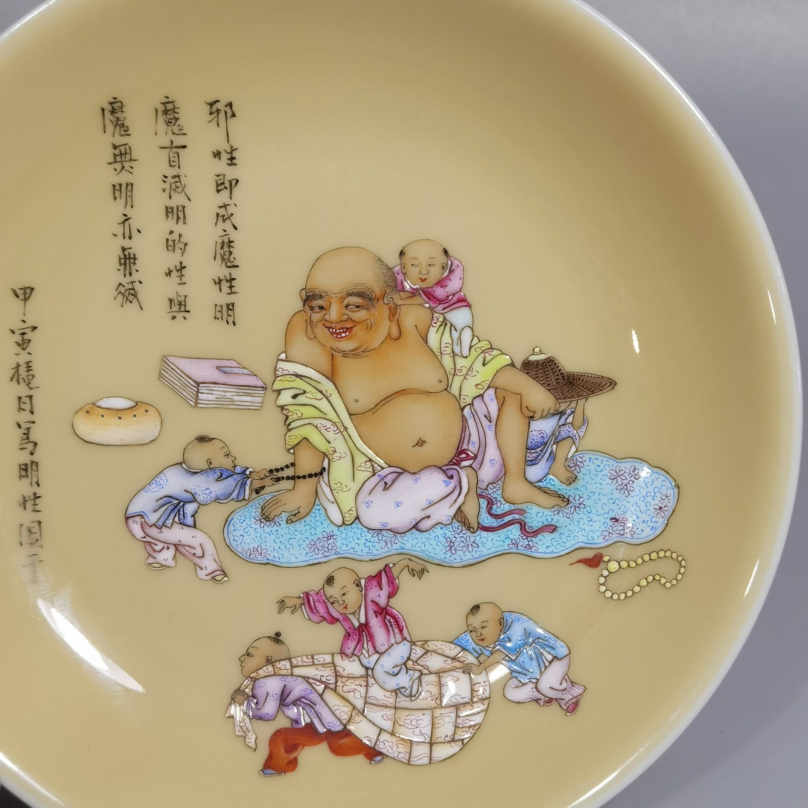 Qing Dynasty Yongzheng beige glaze pastel cloth bag monk and five sons small plate