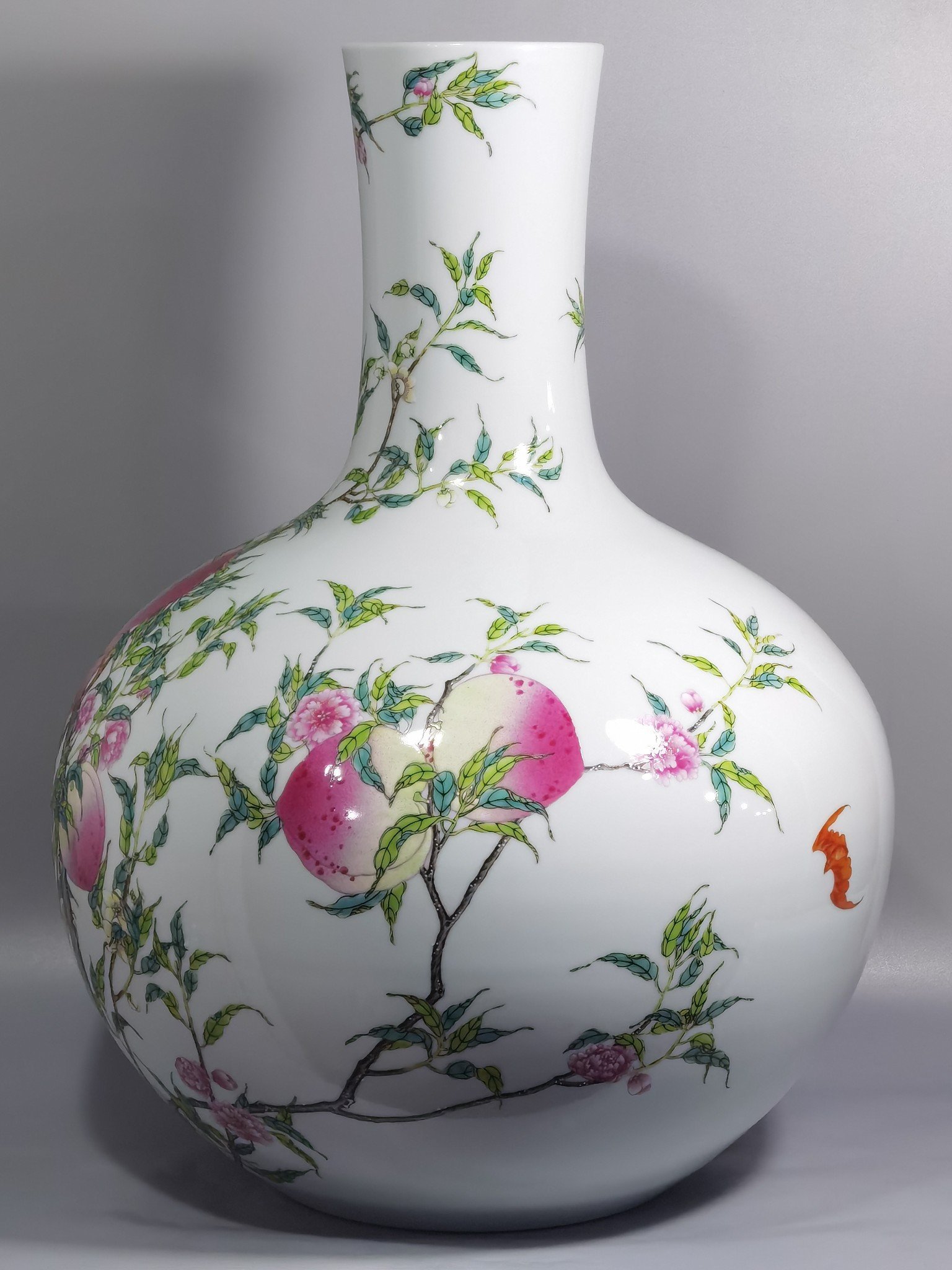 Qing Dynasty Yongzheng famille rose eight peach celestial sphere vase