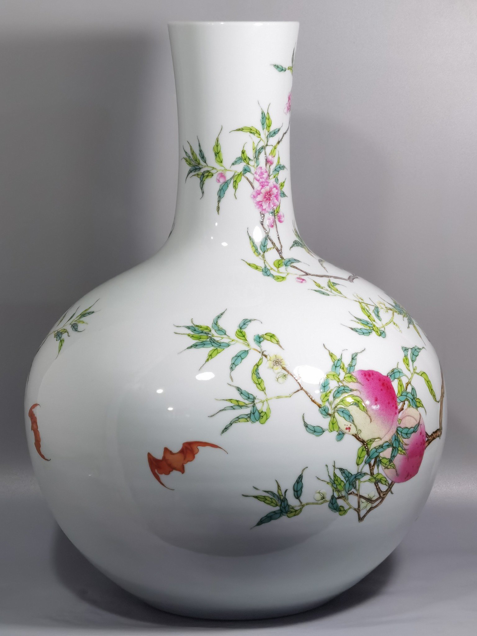 Qing Dynasty Yongzheng famille rose eight peach celestial sphere vase
