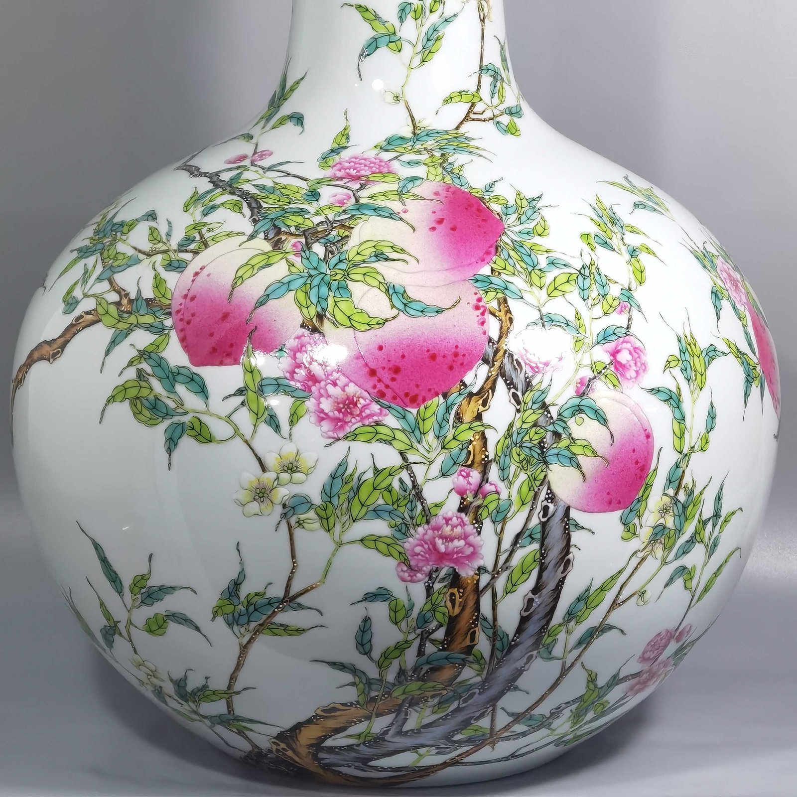 Qing Dynasty Yongzheng famille rose eight peach celestial sphere vase