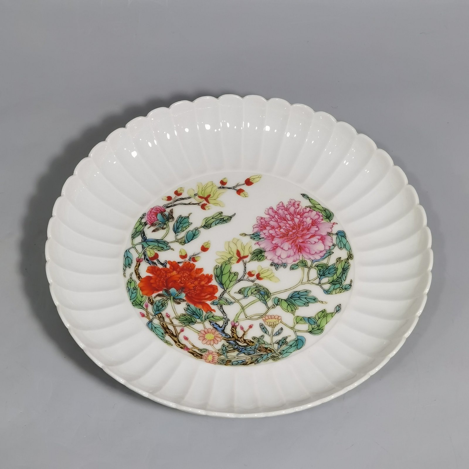 Qing Dynasty Yongzheng pair of plates with pastel peonies and floral patterns
