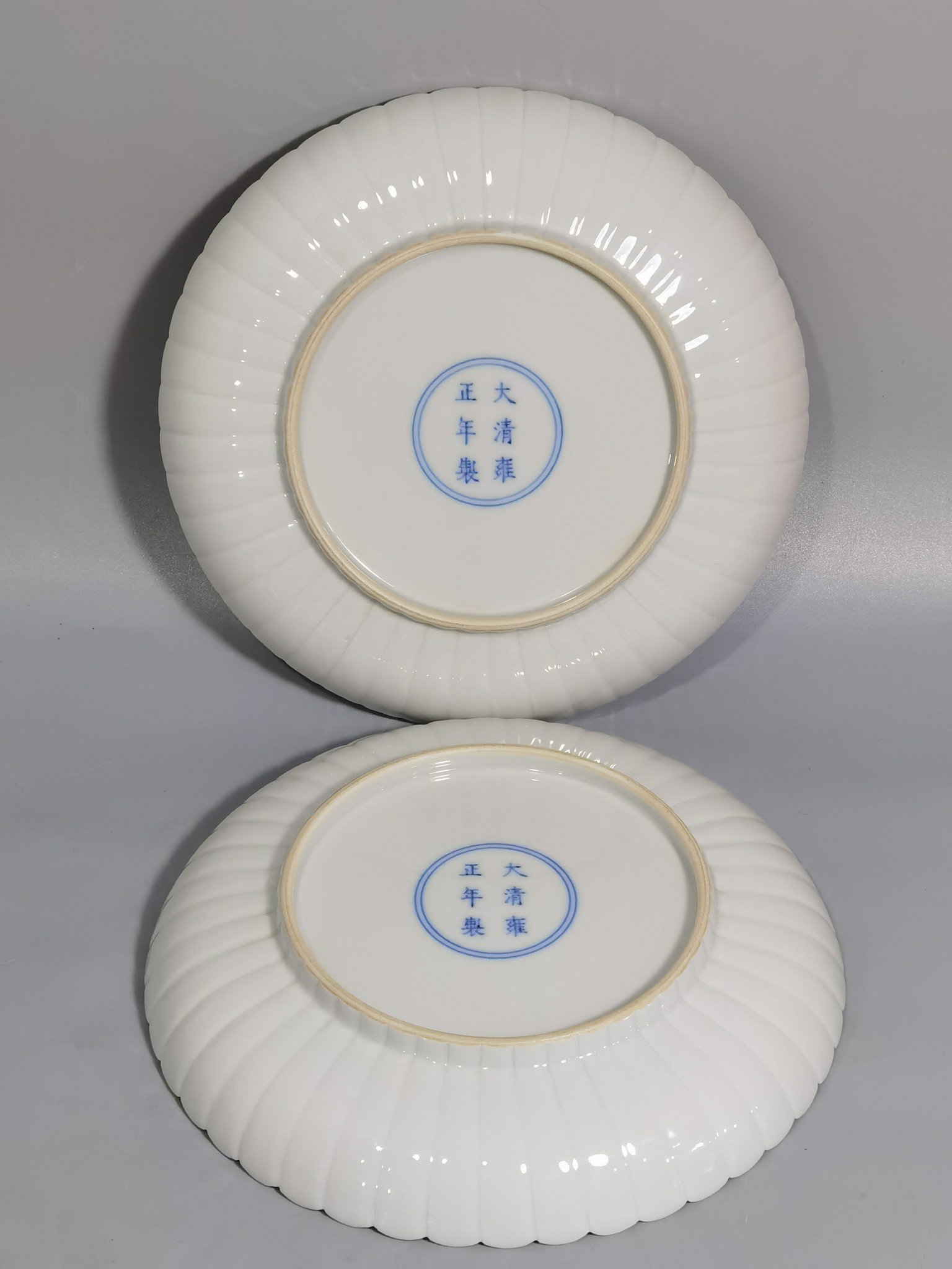 Qing Dynasty Yongzheng pair of plates with pastel peonies and floral patterns