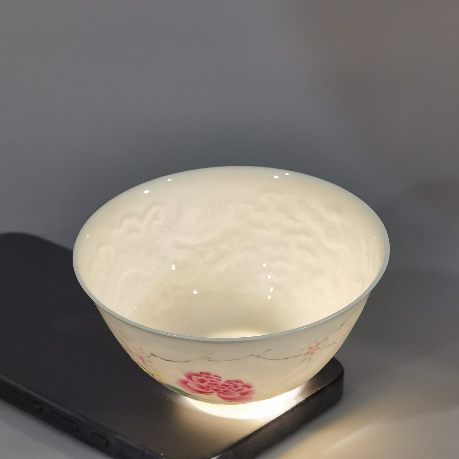 Qing Dynasty Yongzheng pair of tea circles with pastel peonies and poems