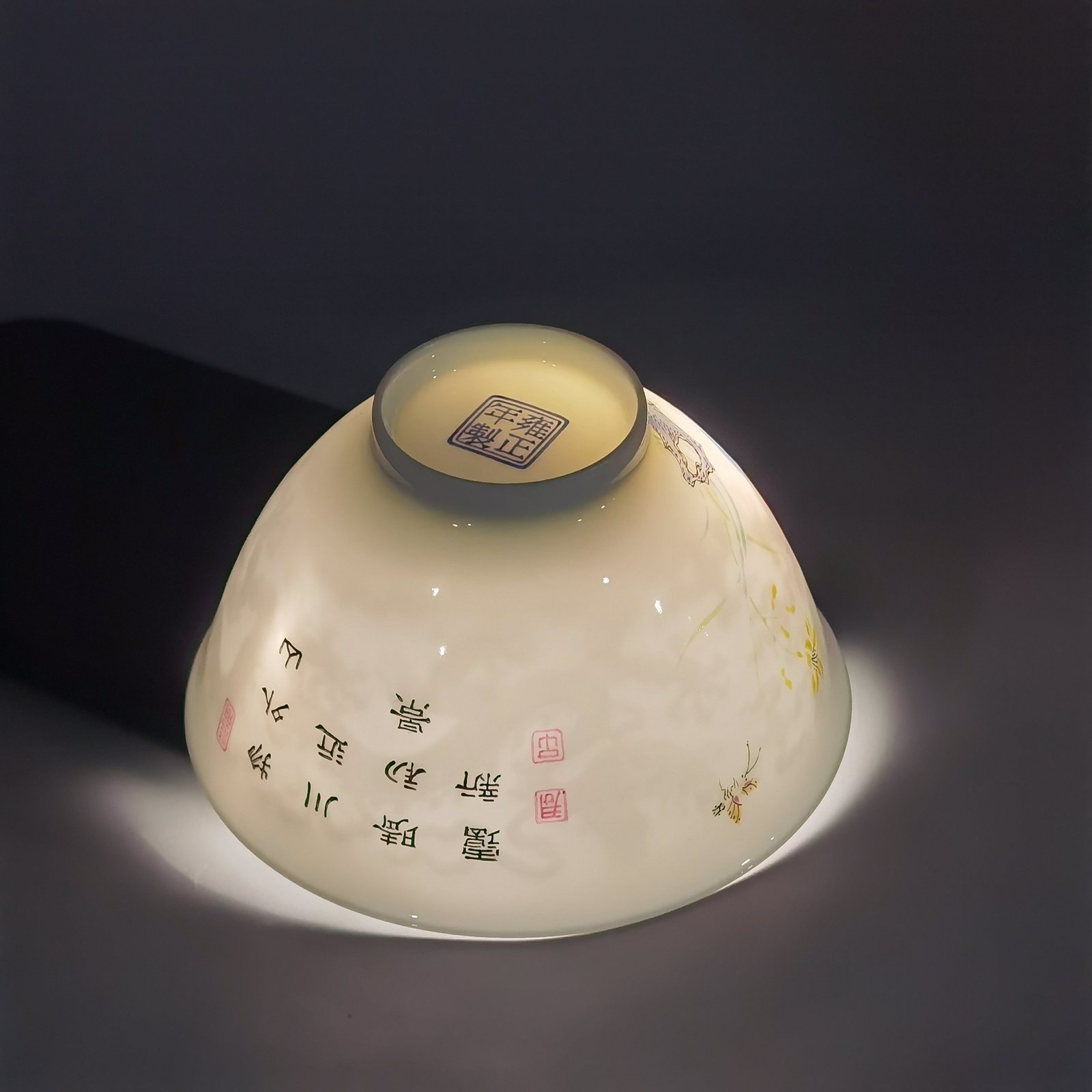 Qing Dynasty Yongzheng pair of tea circles with pastel peonies and poems