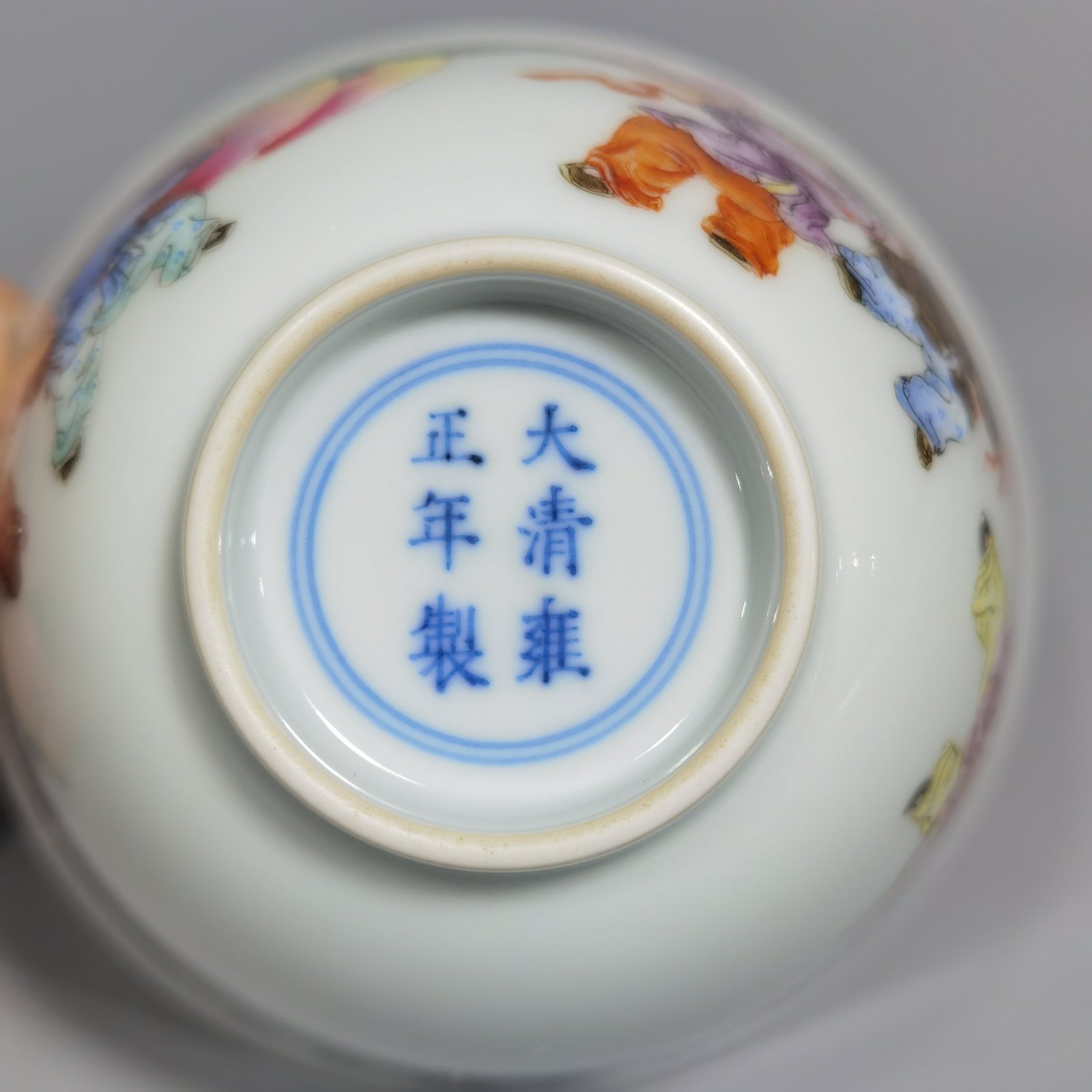 Qing Dynasty Yongzheng pair of pastel-painted boys presenting peaches and poems with tea balls