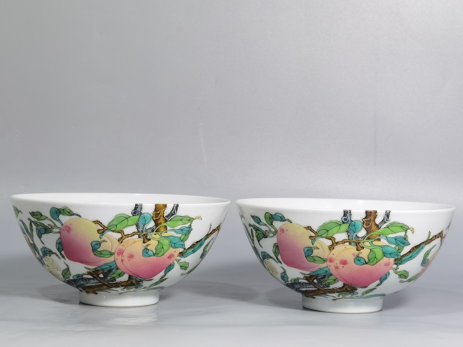 Qing Dynasty Yongzheng pair of famille rose six-peach and five-blessing bowls