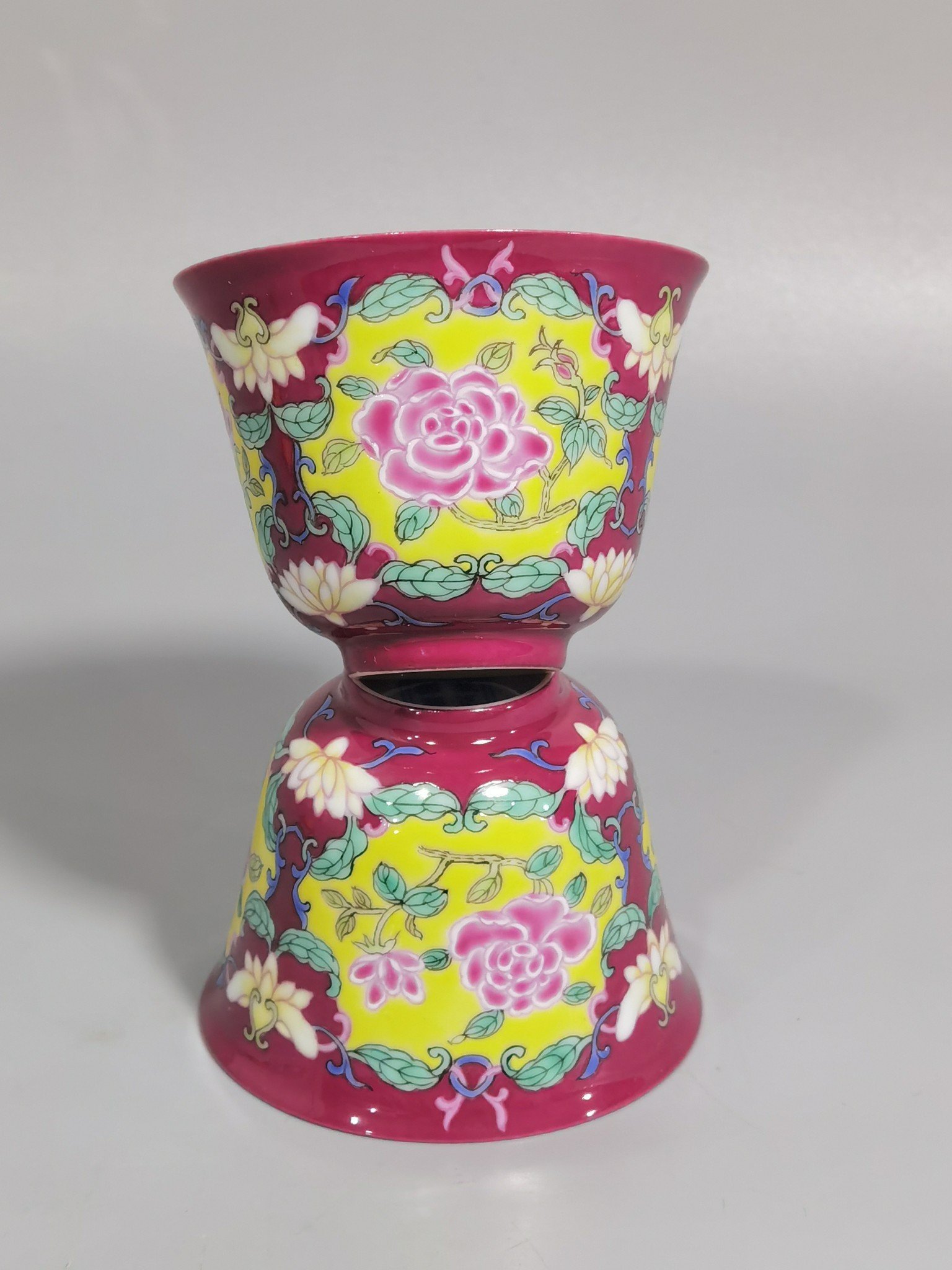 Qing Dynasty Yongzheng rouge ground Yangcai consecrated rose pattern cup