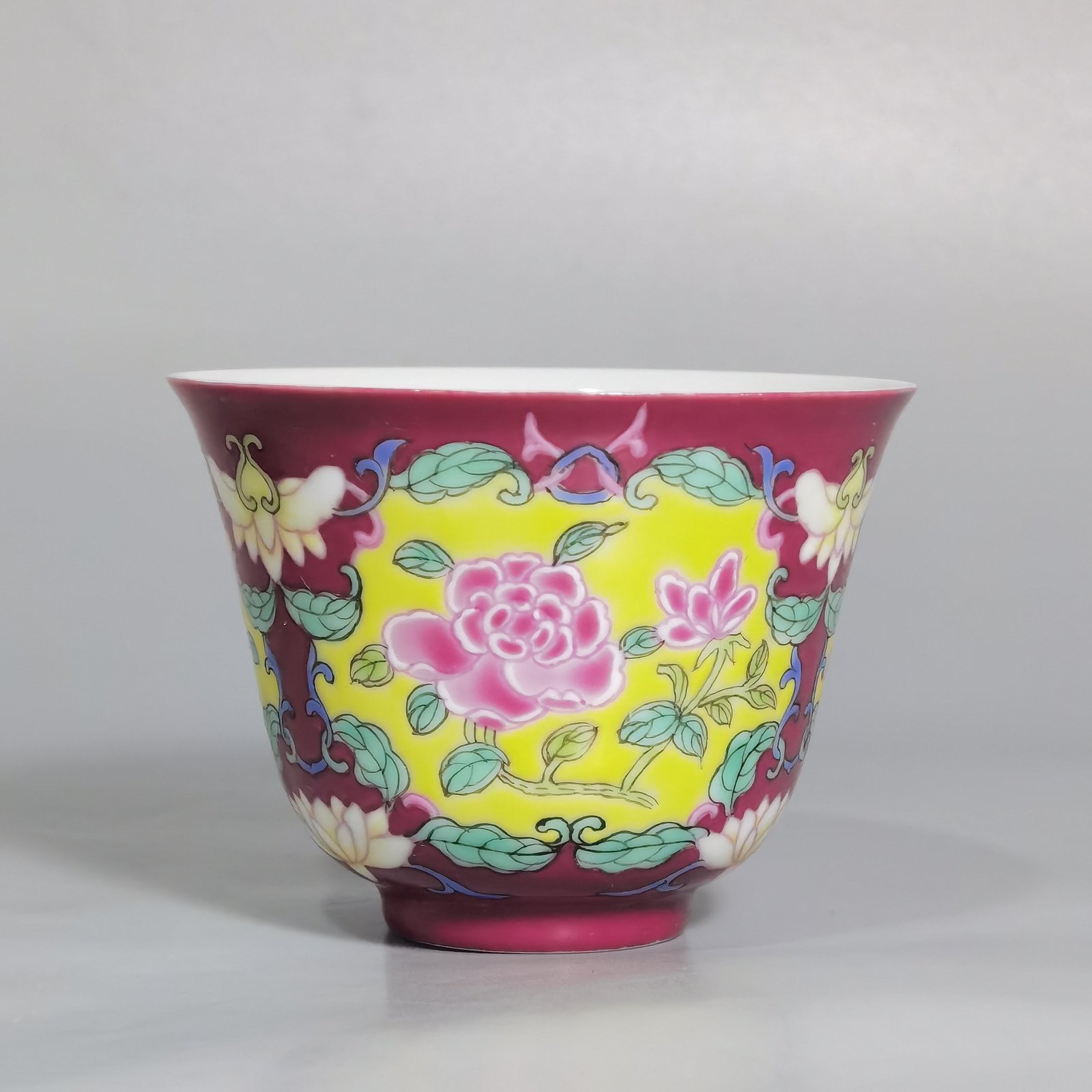 Qing Dynasty Yongzheng rouge ground Yangcai consecrated rose pattern cup