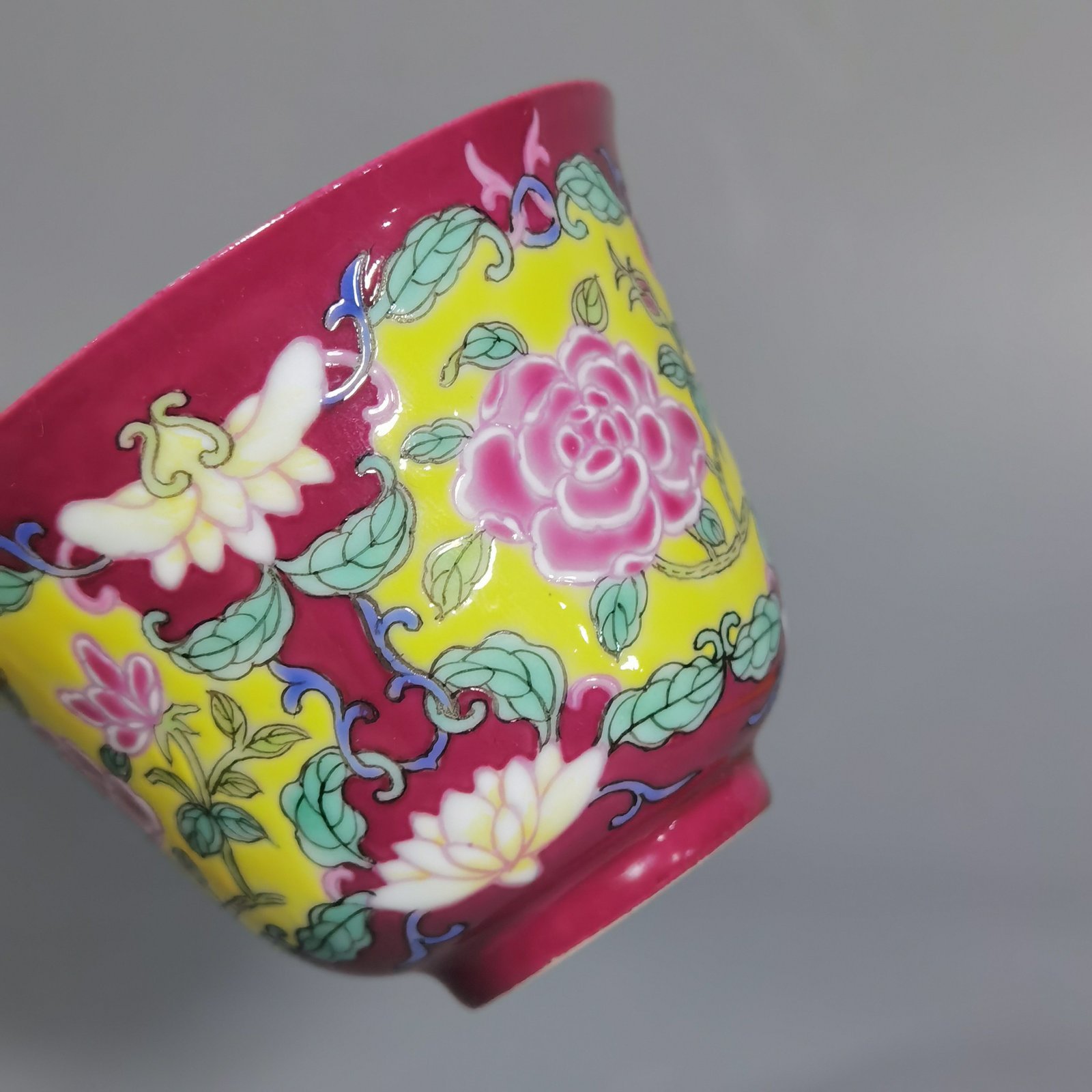 Qing Dynasty Yongzheng rouge ground Yangcai consecrated rose pattern cup