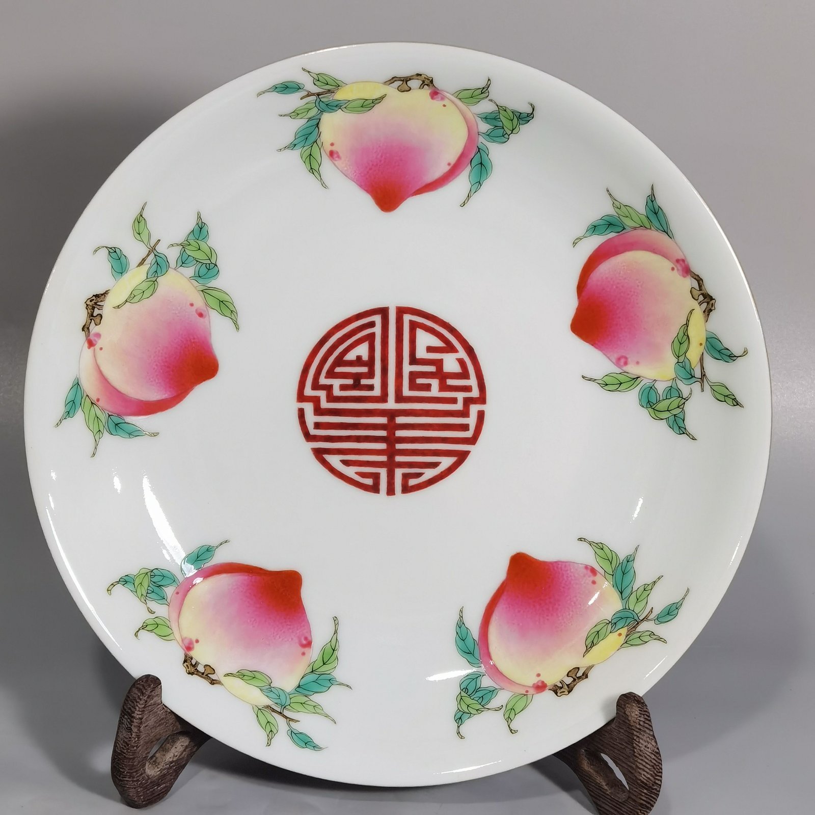 Qing Dynasty Yongzheng rouge ground pastel windowed flower plate
