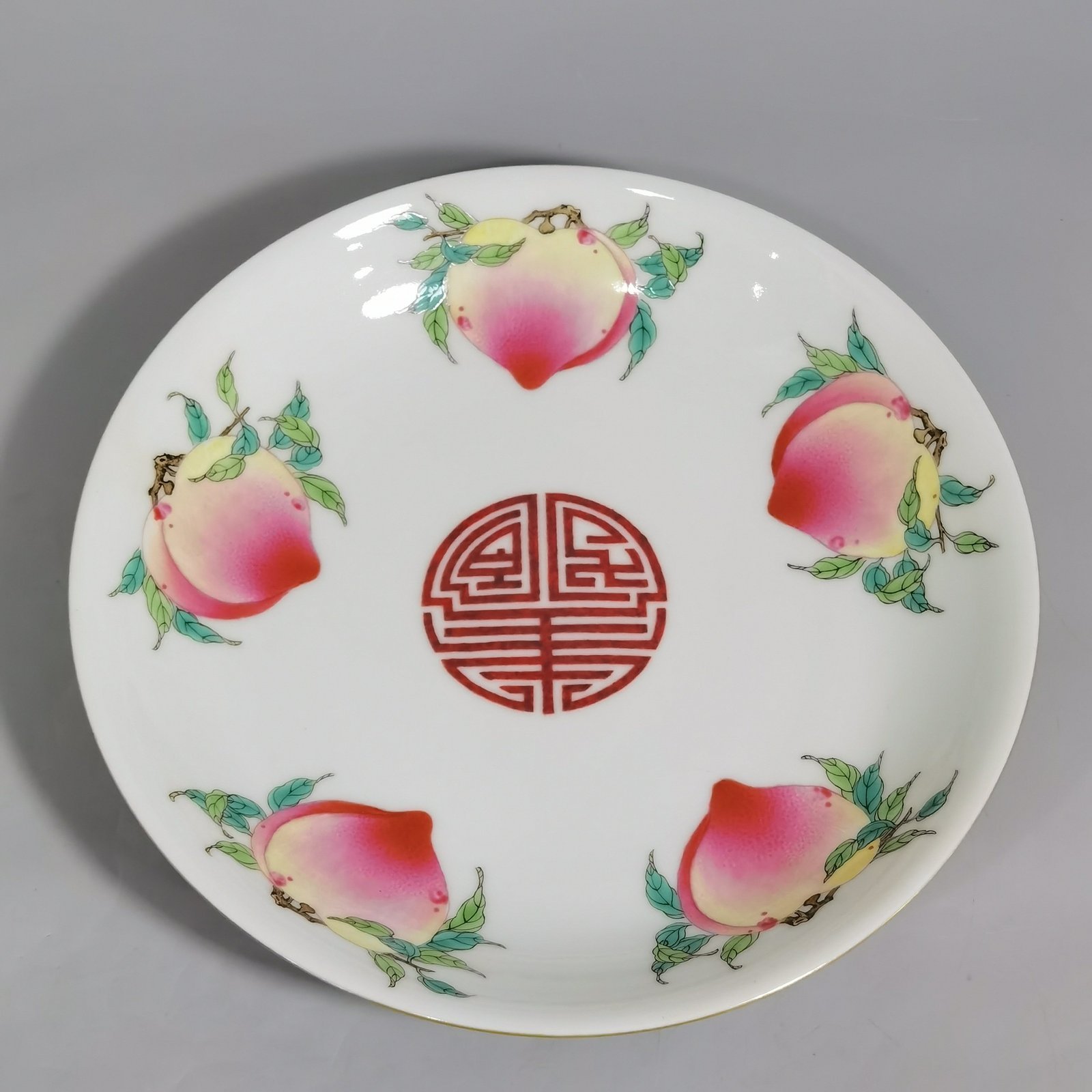 Qing Dynasty Yongzheng rouge ground pastel windowed flower plate