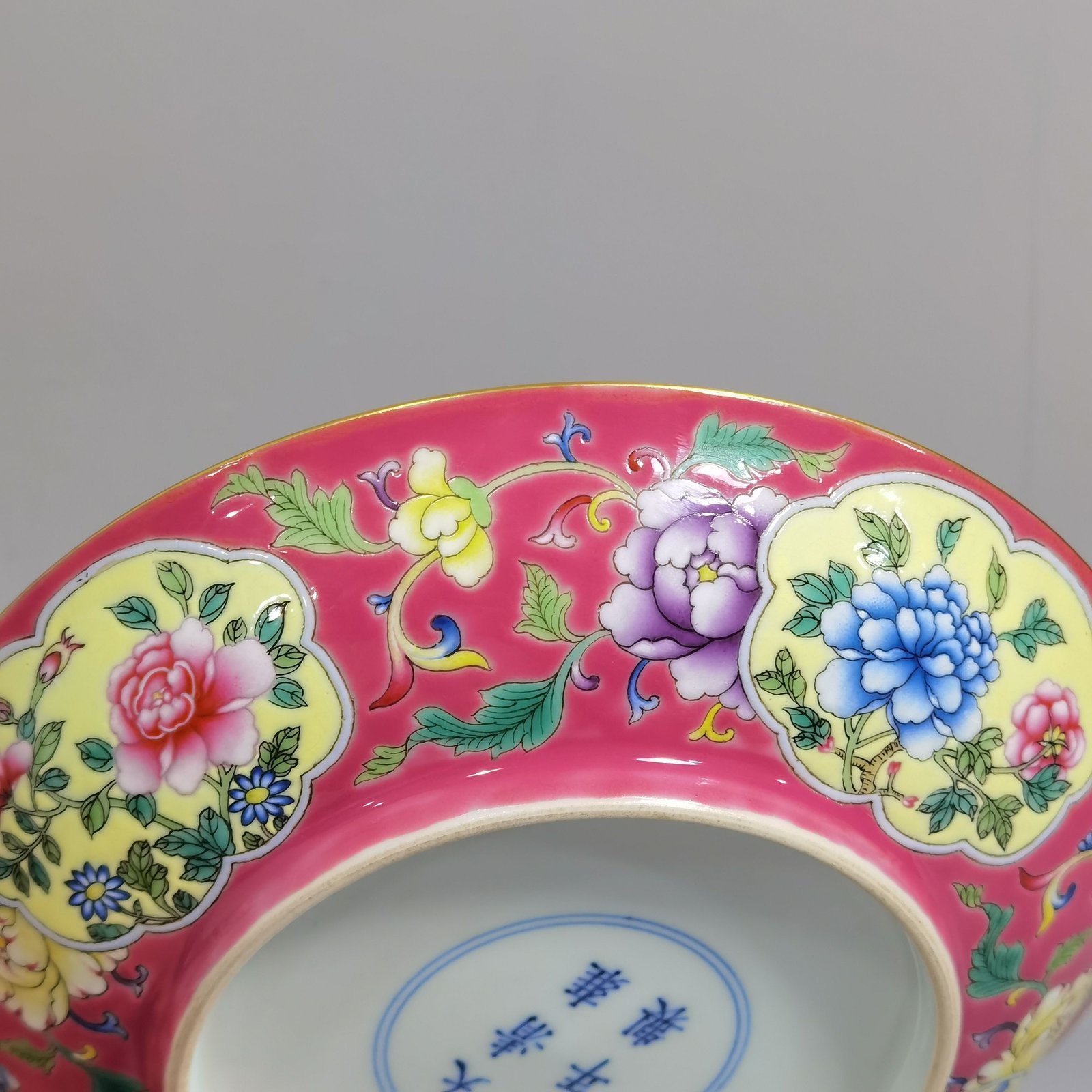 Qing Dynasty Yongzheng rouge ground pastel windowed flower plate
