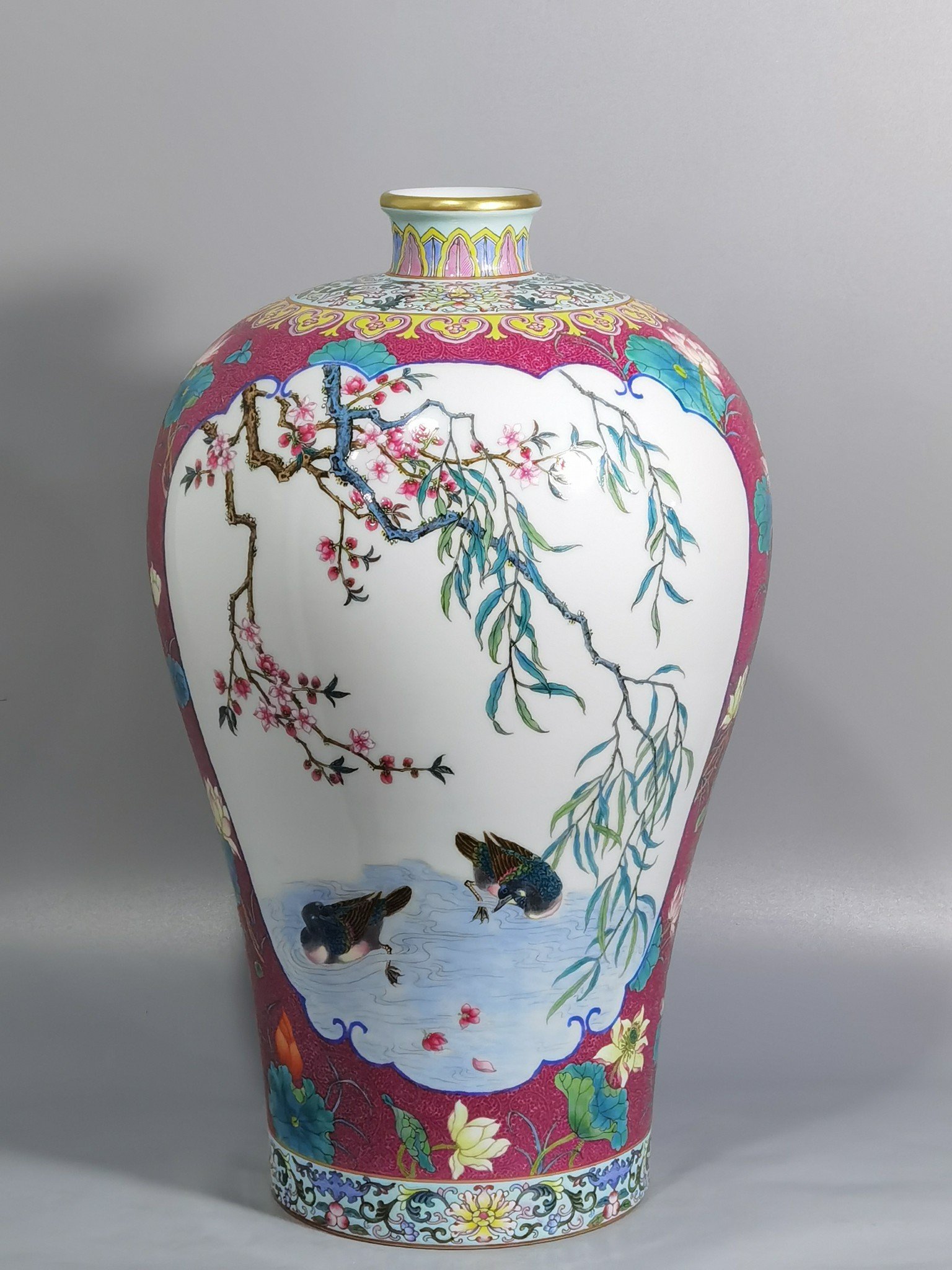 Qing Dynasty Yongzheng carmine red rolled lotus windowed plum vase