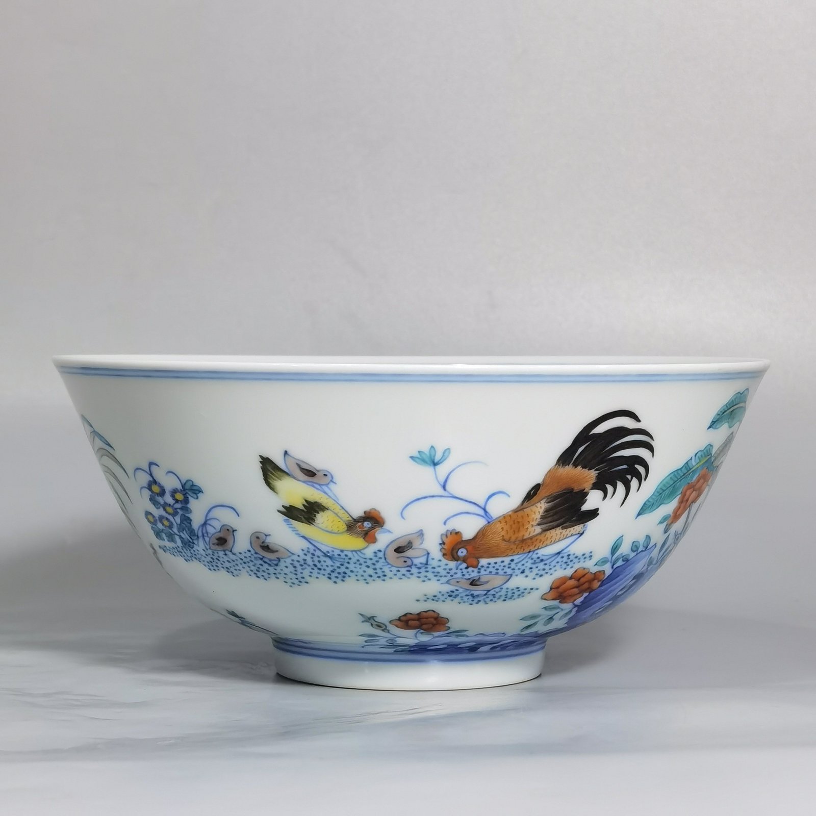 Qing Dynasty Yongzheng blue and white Doucai chicken picture bowl