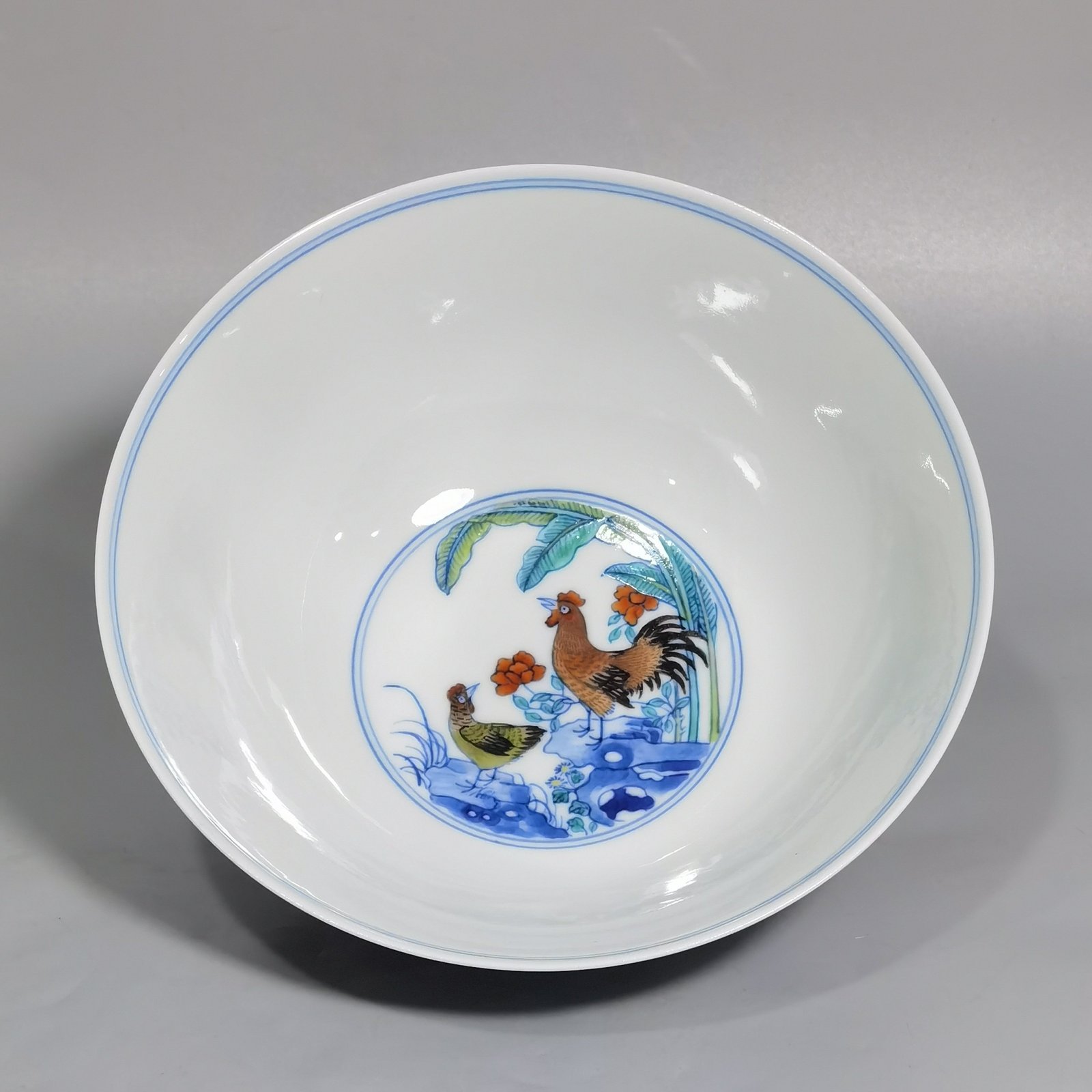 Qing Dynasty Yongzheng blue and white Doucai chicken picture bowl