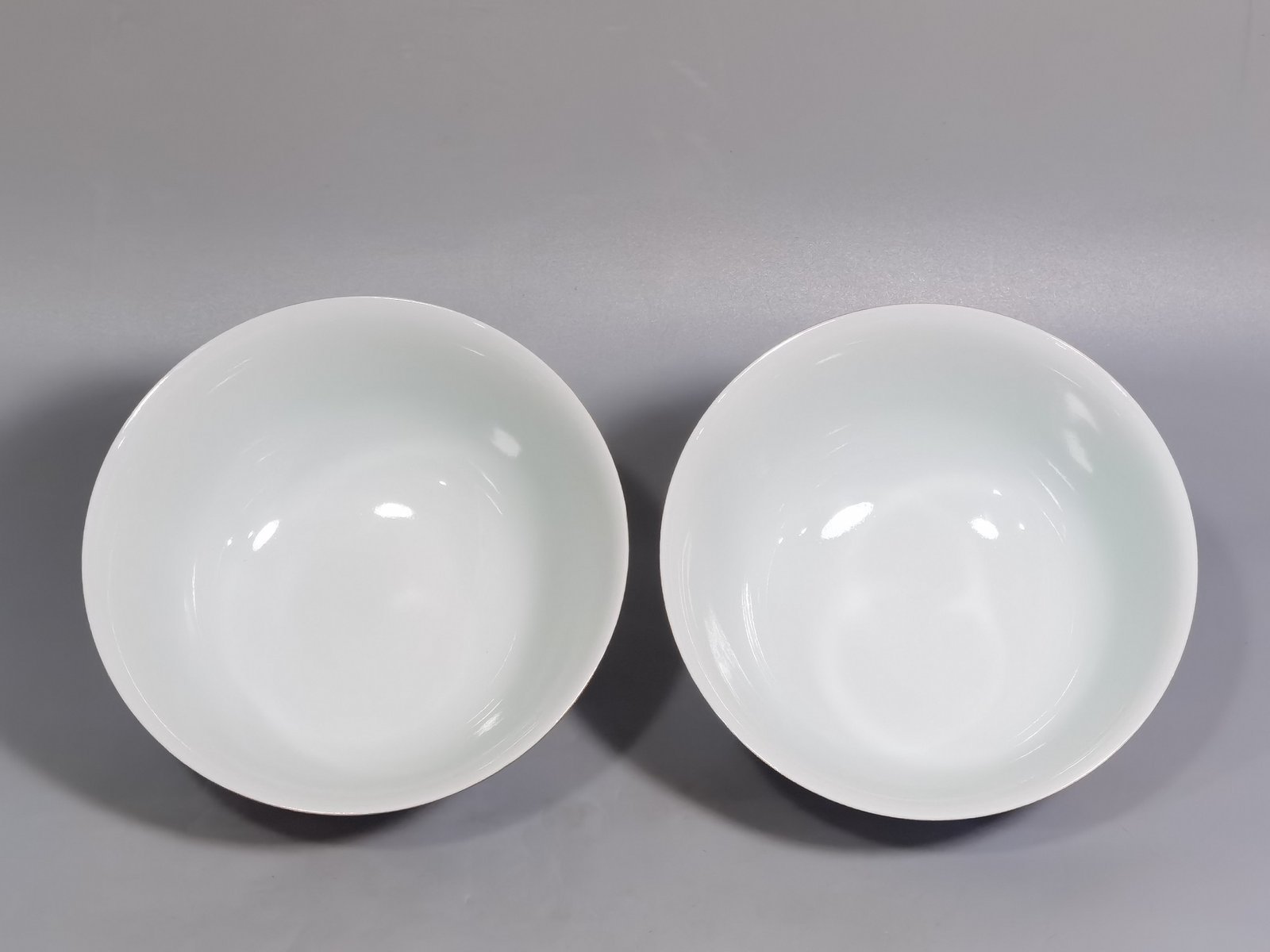 Qing Dynasty Yongzheng pair of enamel colored coral red ground nine-autumn bowls