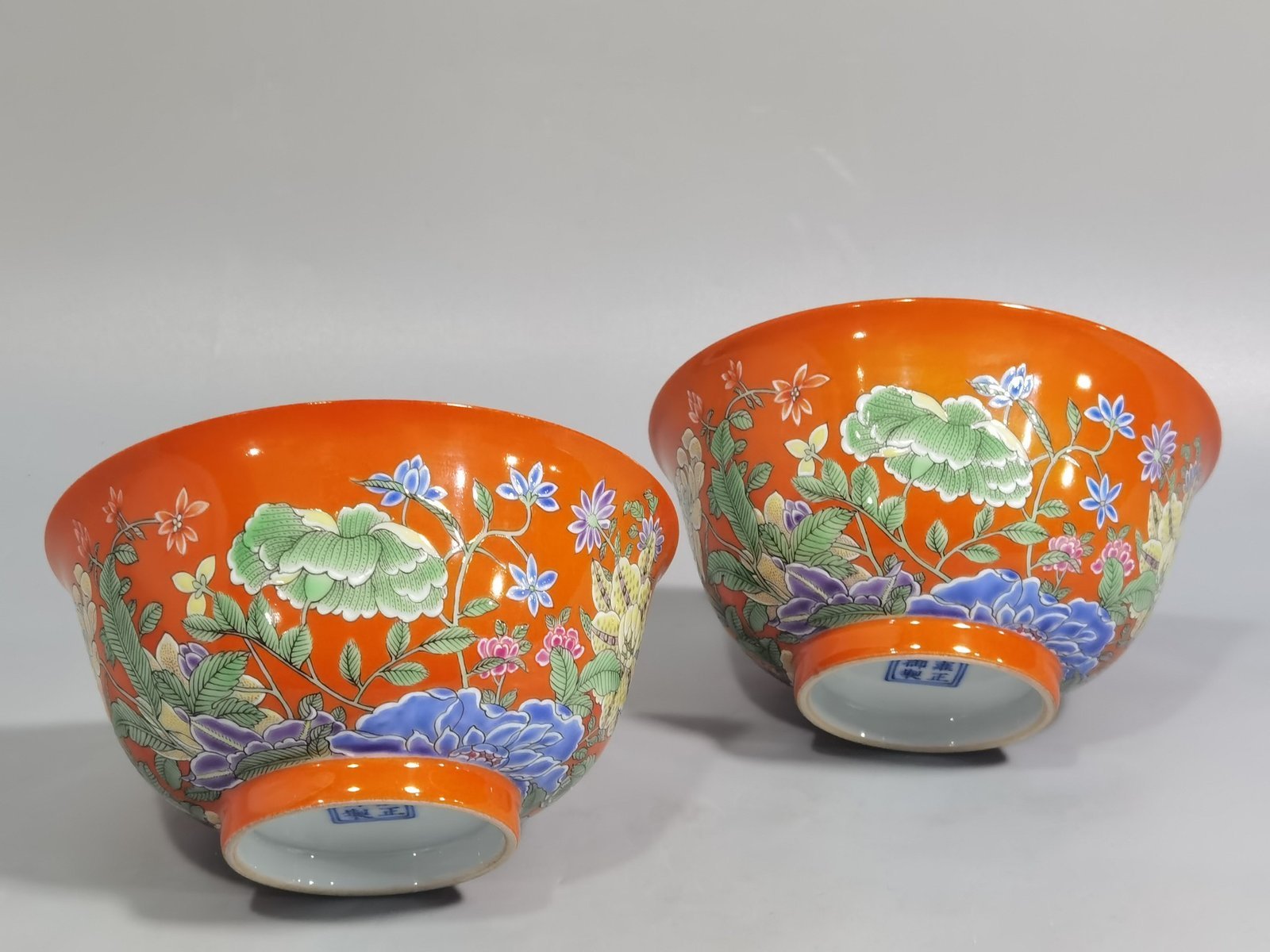 Qing Dynasty Yongzheng pair of enamel colored coral red ground nine-autumn bowls