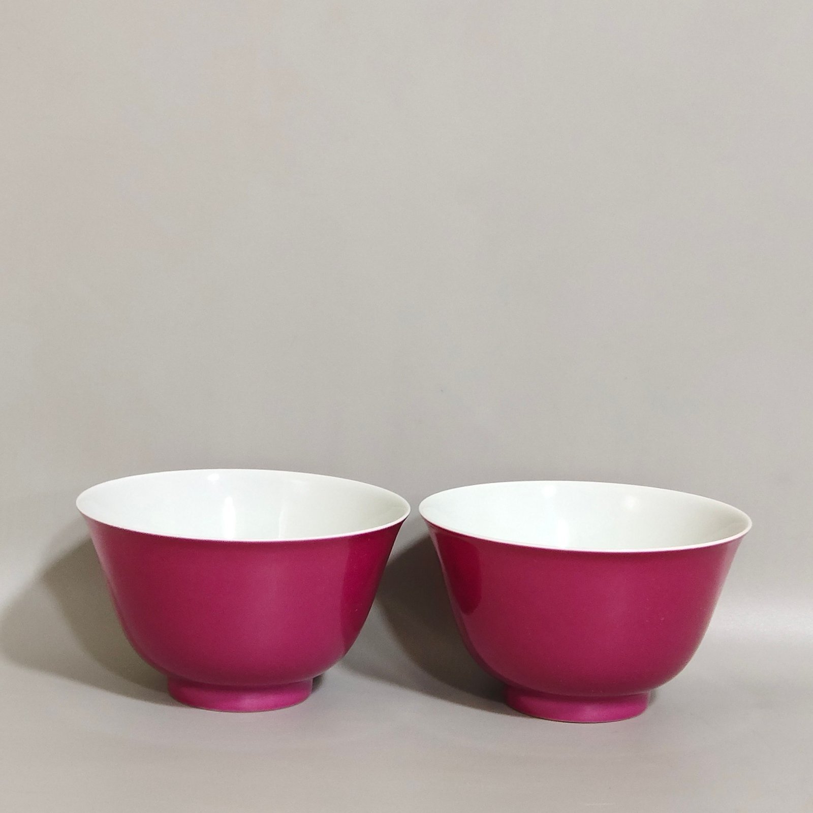 Qing Dynasty Yongzheng pair of cups with rouge red interior and pastel lychee pattern