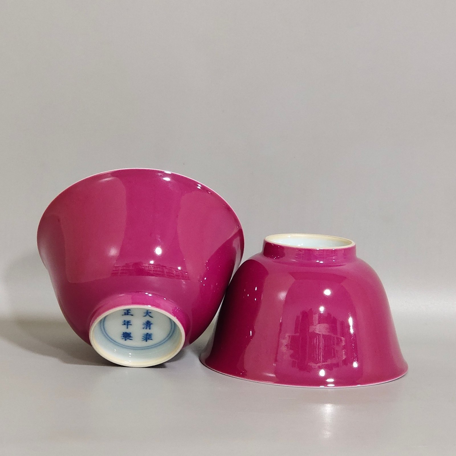 Qing Dynasty Yongzheng pair of cups with rouge red interior and pastel lychee pattern