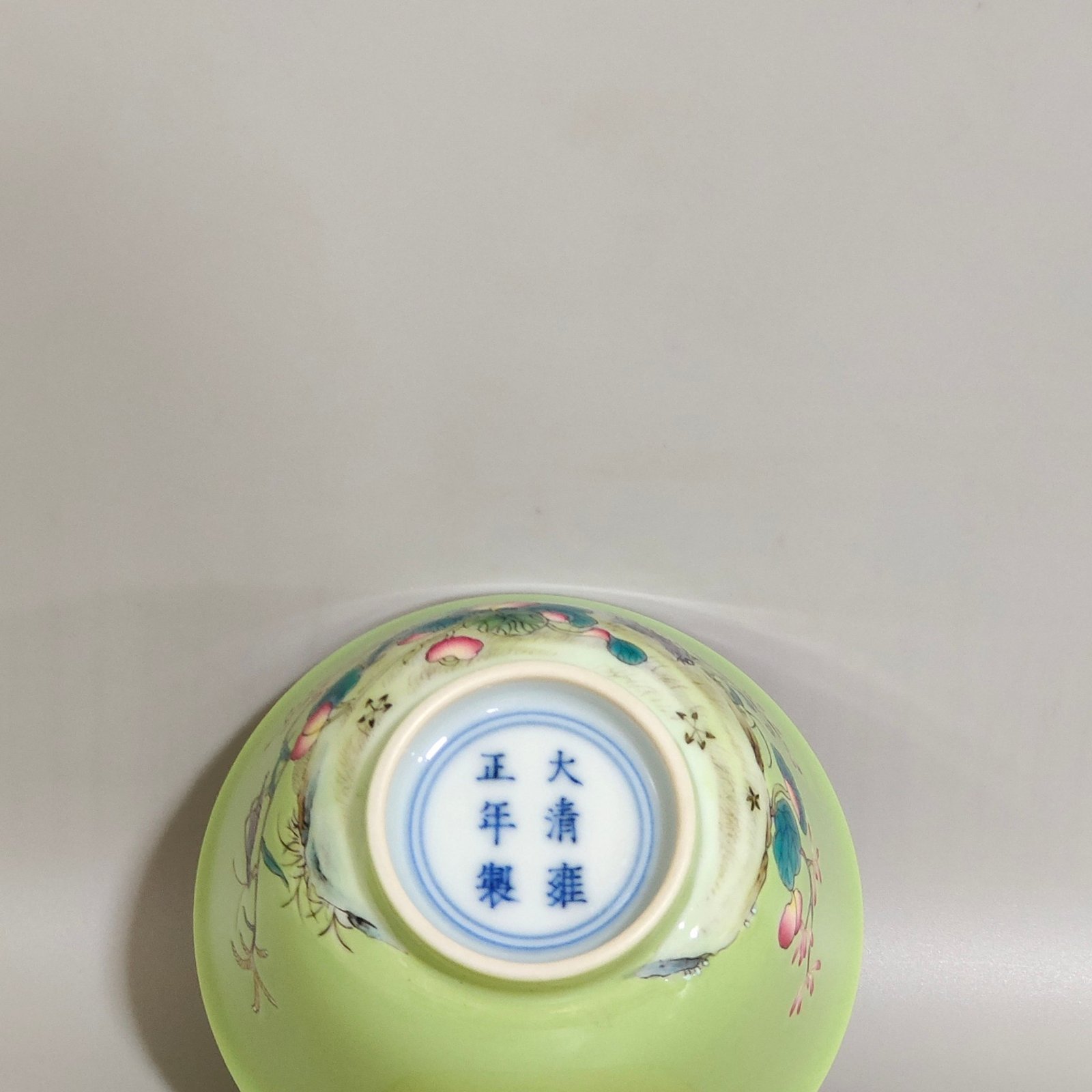 Qing Dynasty Yongzheng apple green glaze pastel cup with flowers birds melons and fruits