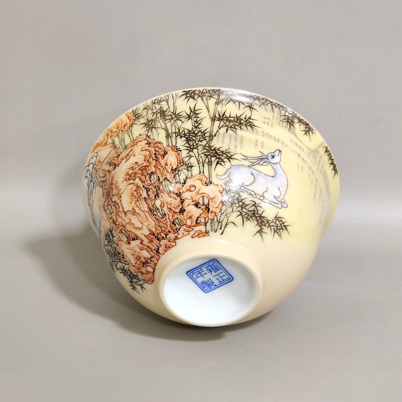 Qing Dynasty Yongzheng ivory white glaze pastel bamboo stone deer pattern poem cup