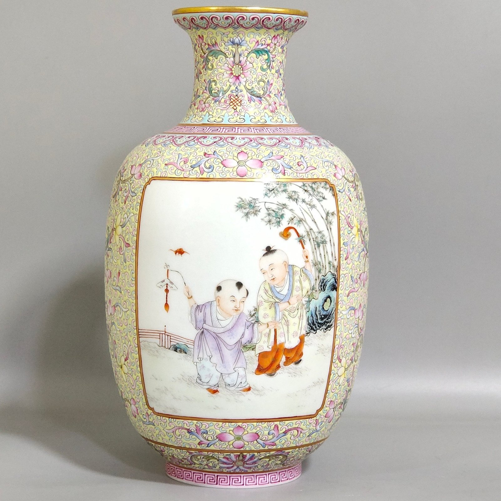 Qing Dynasty Yongzheng thin vase with picture of baby playing with an open window