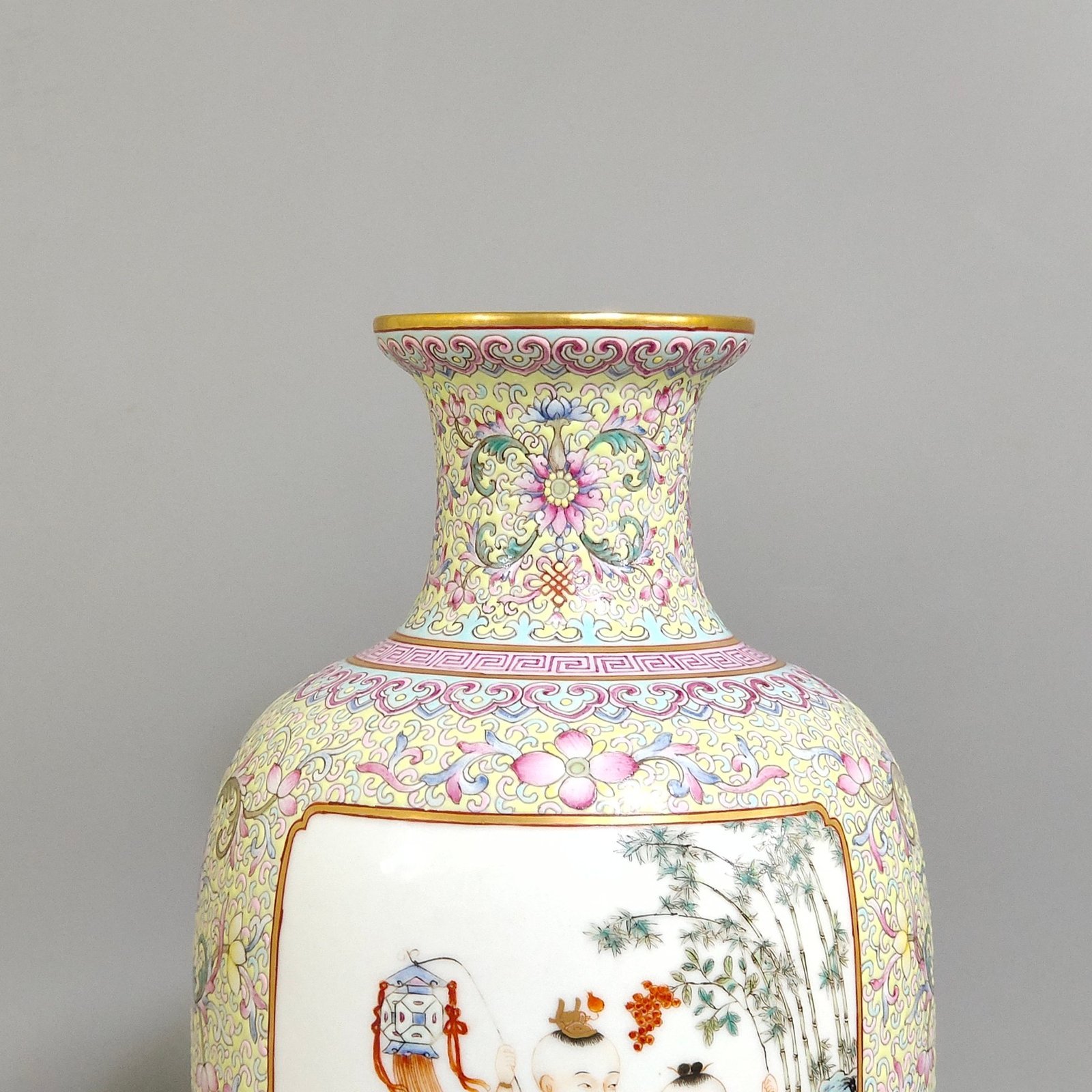 Qing Dynasty Yongzheng thin vase with picture of baby playing with an open window