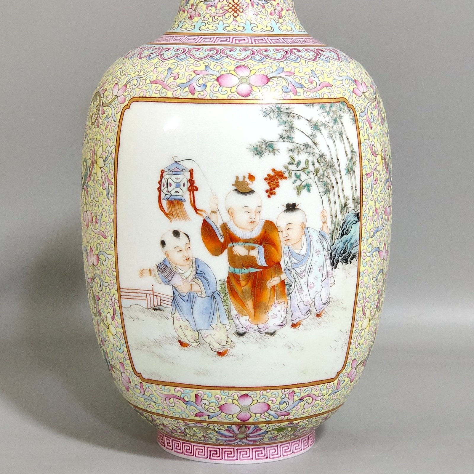Qing Dynasty Yongzheng thin vase with picture of baby playing with an open window