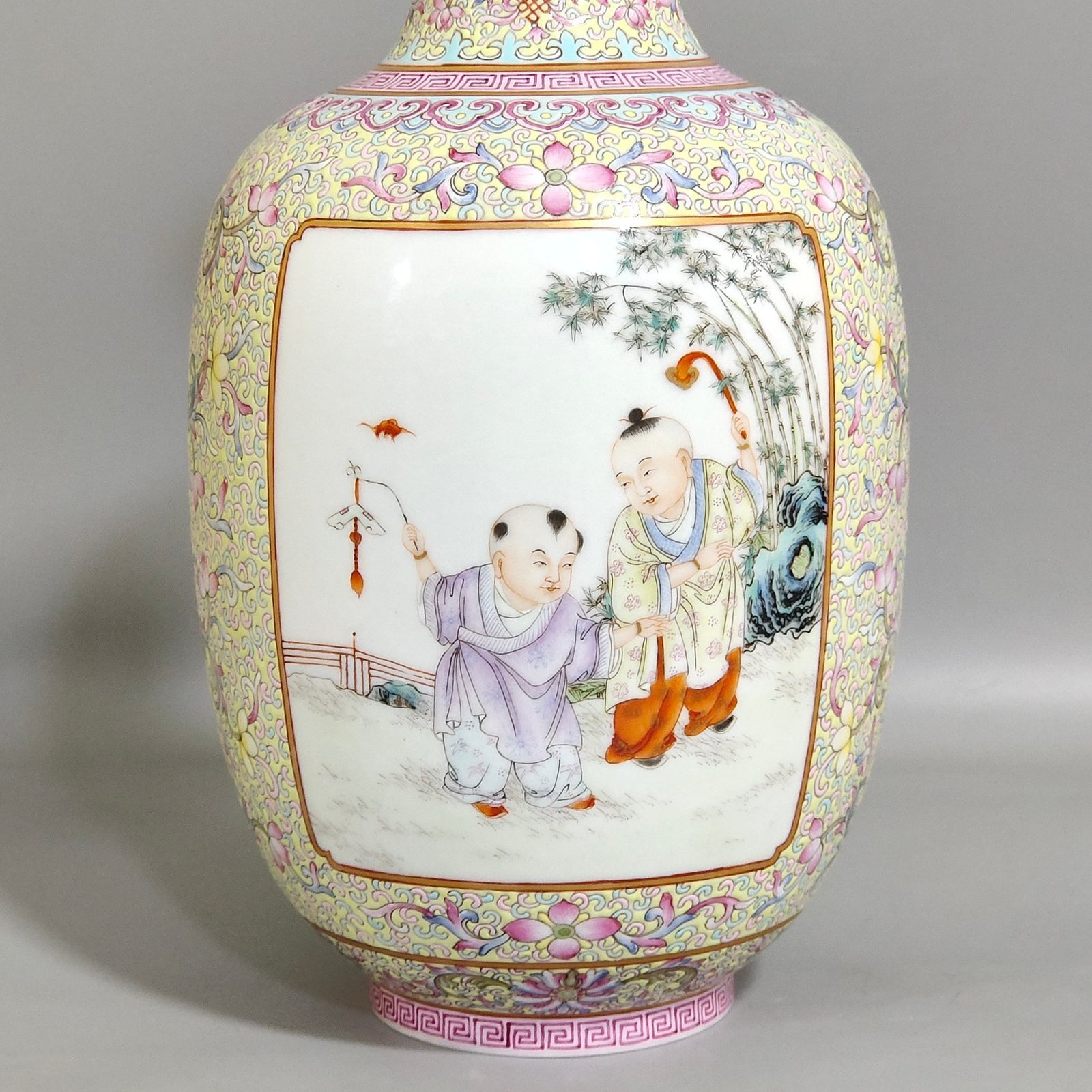 Qing Dynasty Yongzheng thin vase with picture of baby playing with an open window