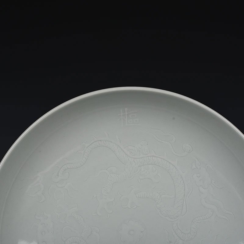 Yuan Dynasty kiln egg white glaze carved dragon plate
