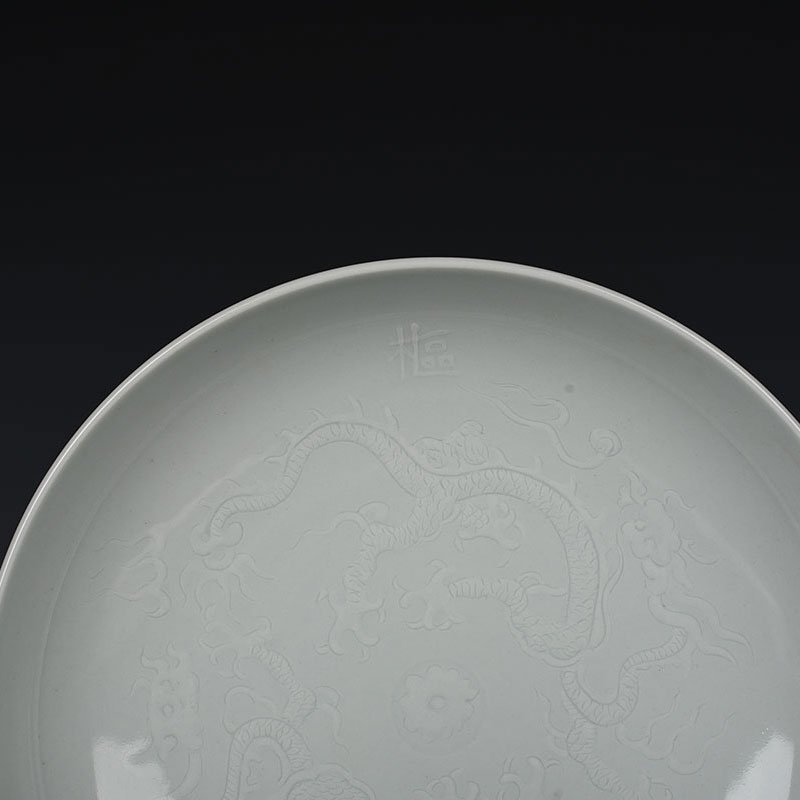 Yuan Dynasty kiln egg white glaze carved dragon plate