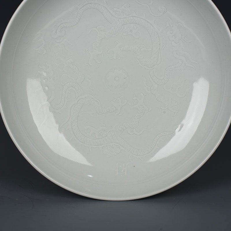 Yuan Dynasty kiln egg white glaze carved dragon plate