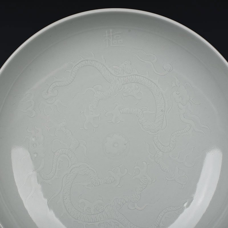 Yuan Dynasty kiln egg white glaze carved dragon plate