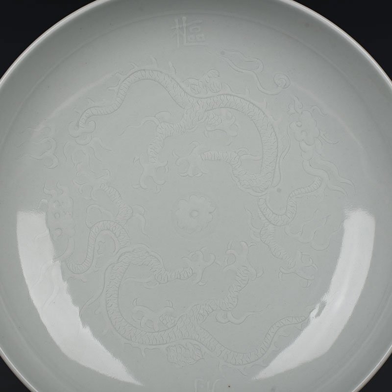 Yuan Dynasty kiln egg white glaze carved dragon plate