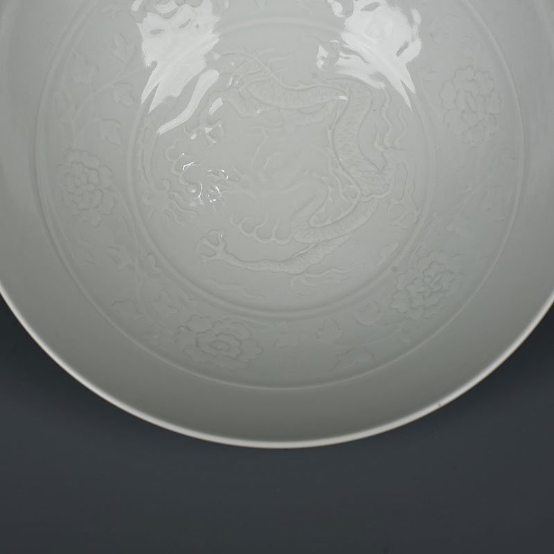 Yuan Dynasty kiln egg white glaze carved dragon bowl