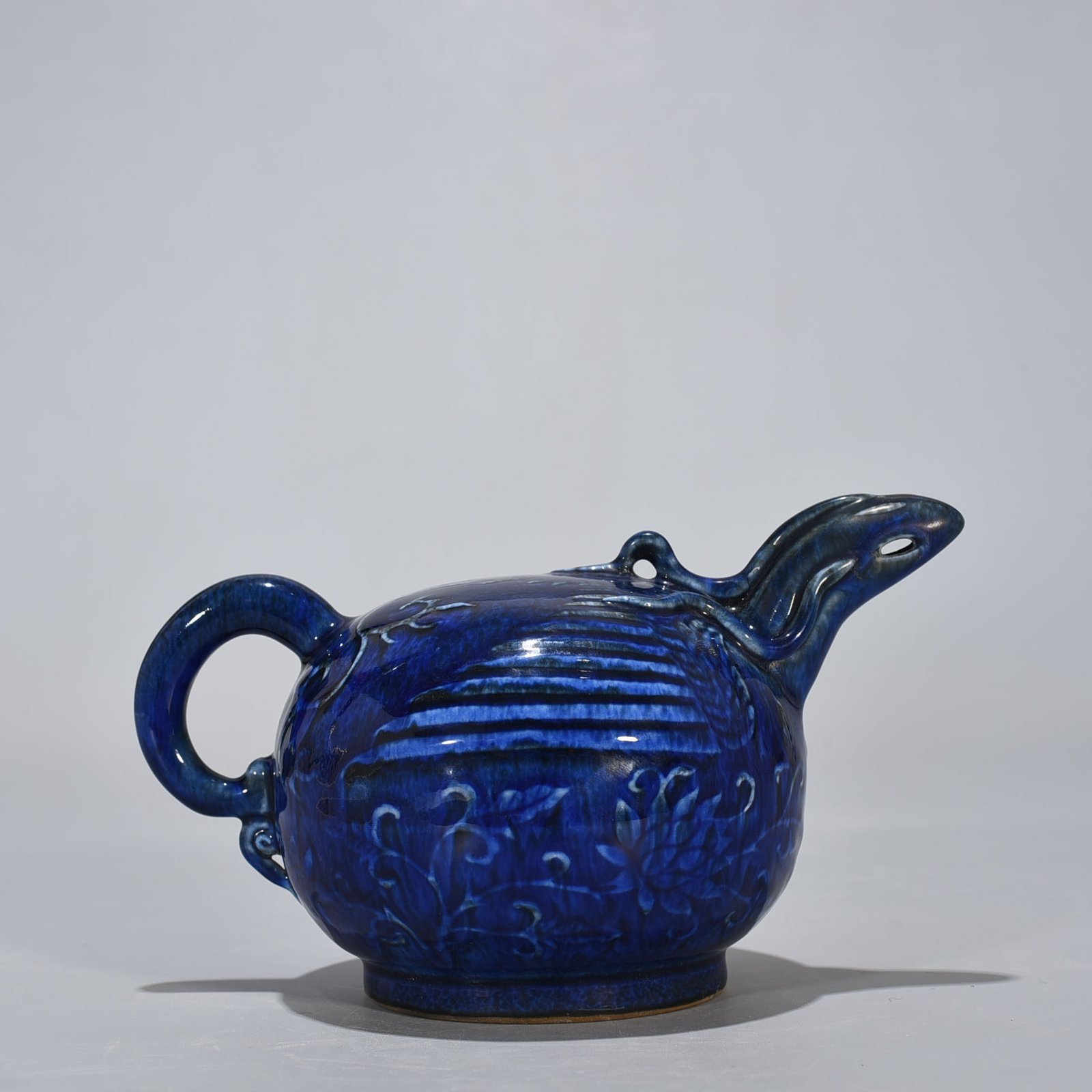 Yuan Dynasty blue glaze phoenix head backflow pot